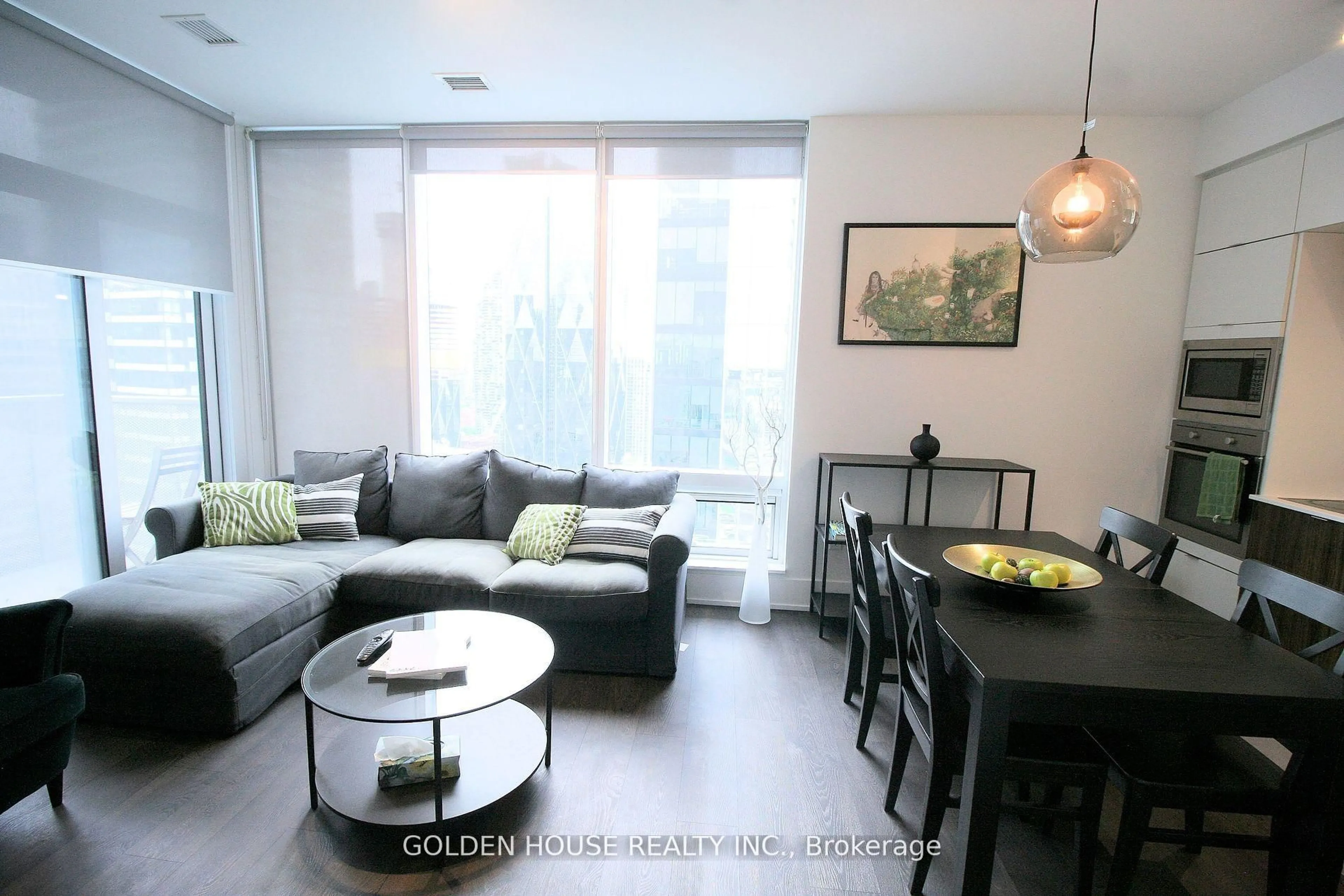 Living room with furniture, wood/laminate floor for 10 York St #3803, Toronto Ontario M5J 0E1