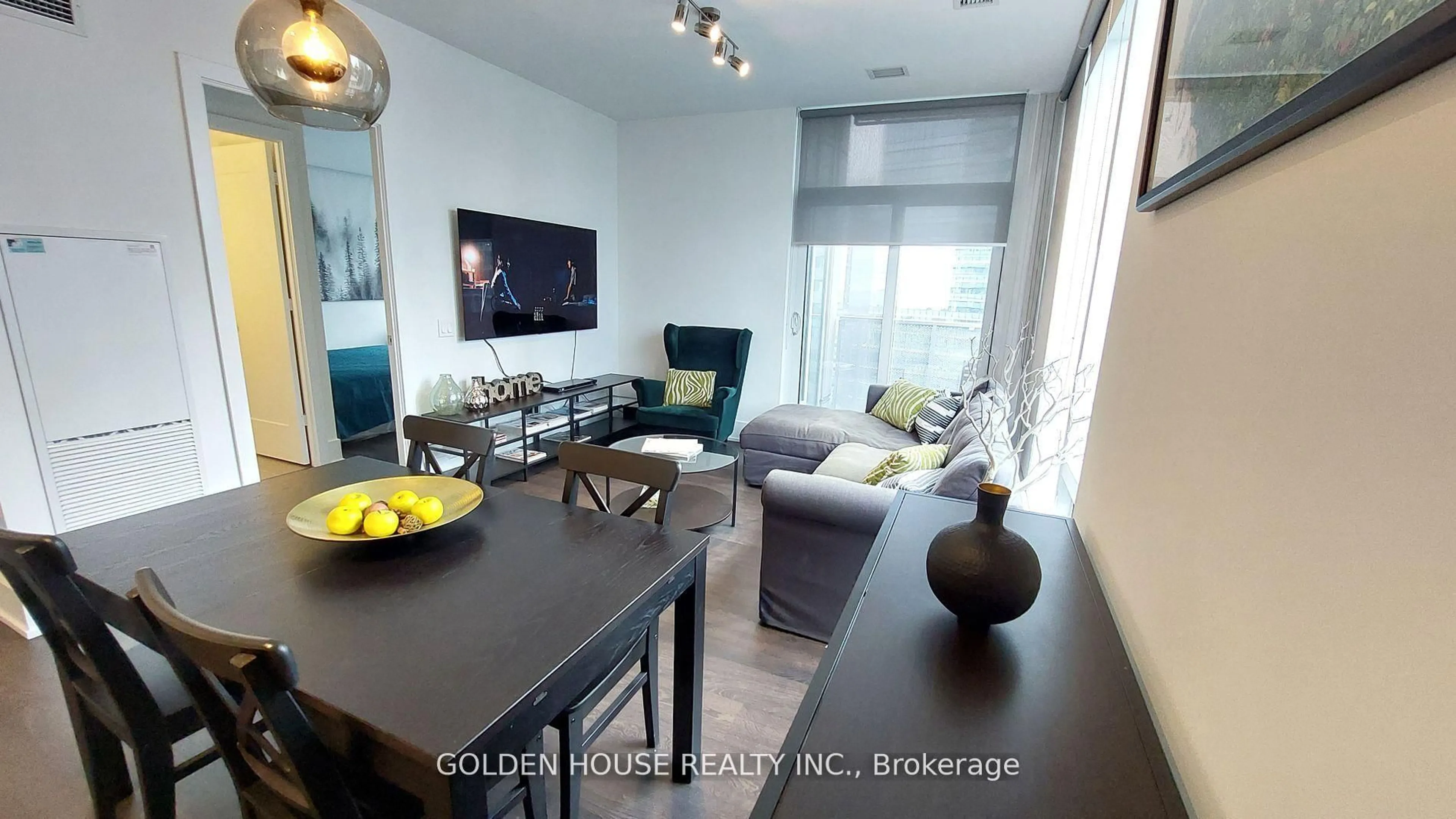Living room with furniture, wood/laminate floor for 10 York St #3803, Toronto Ontario M5J 0E1