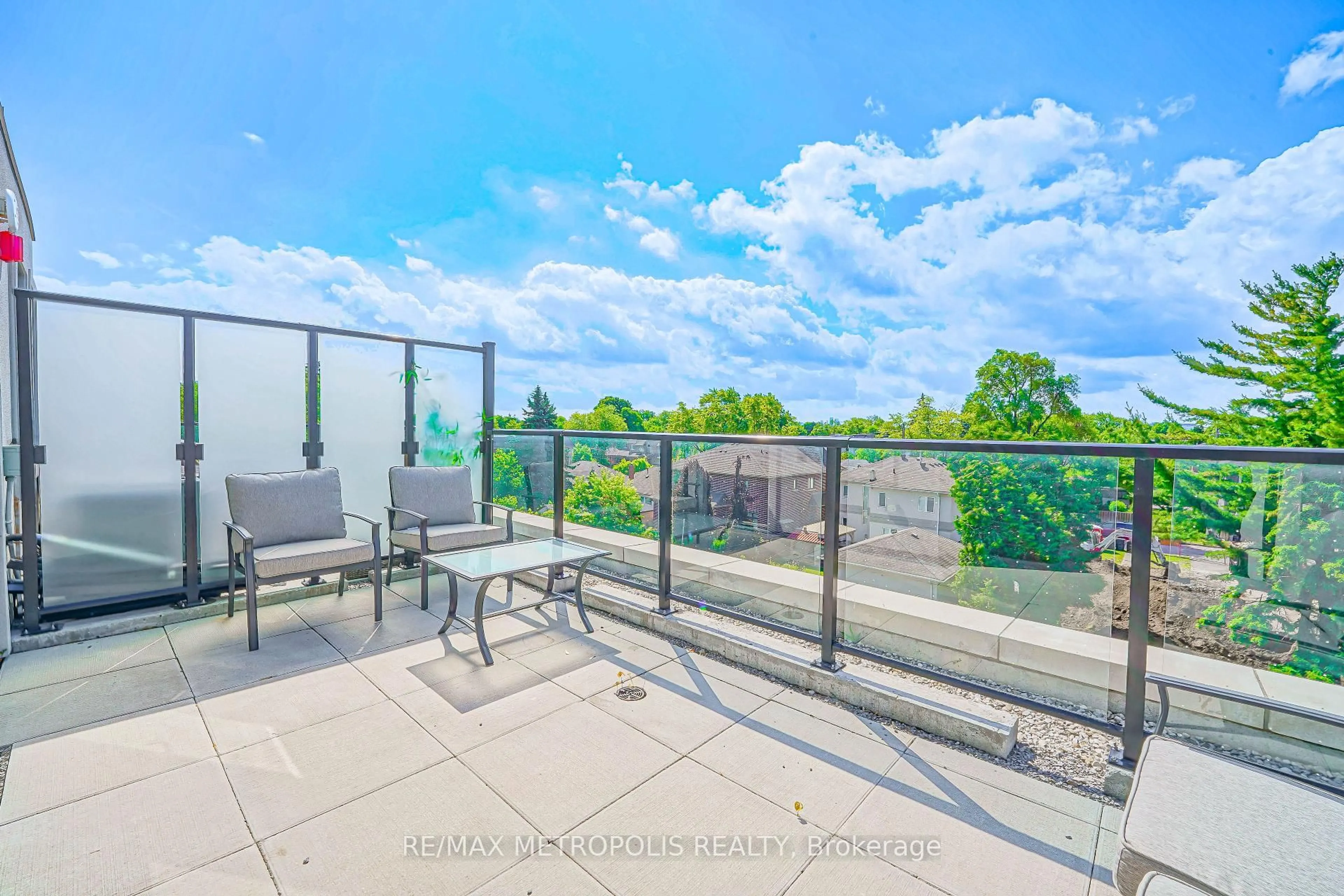 Patio, city buildings view from balcony for 871 Sheppard Ave #29, Toronto Ontario M3H 0E8