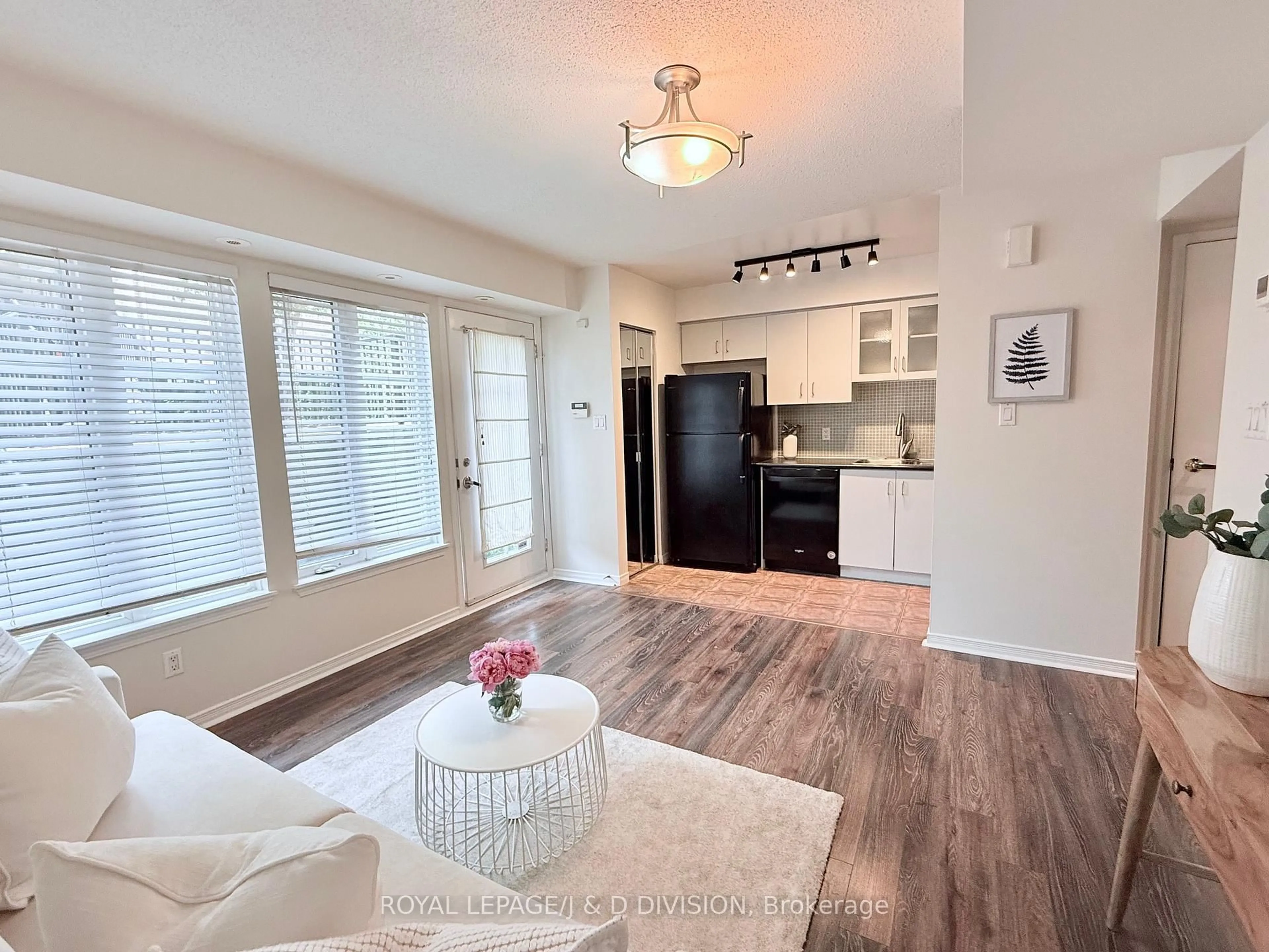 Living room with furniture, wood/laminate floor for 34 Western Battery Rd #402, Toronto Ontario M6K 3N9