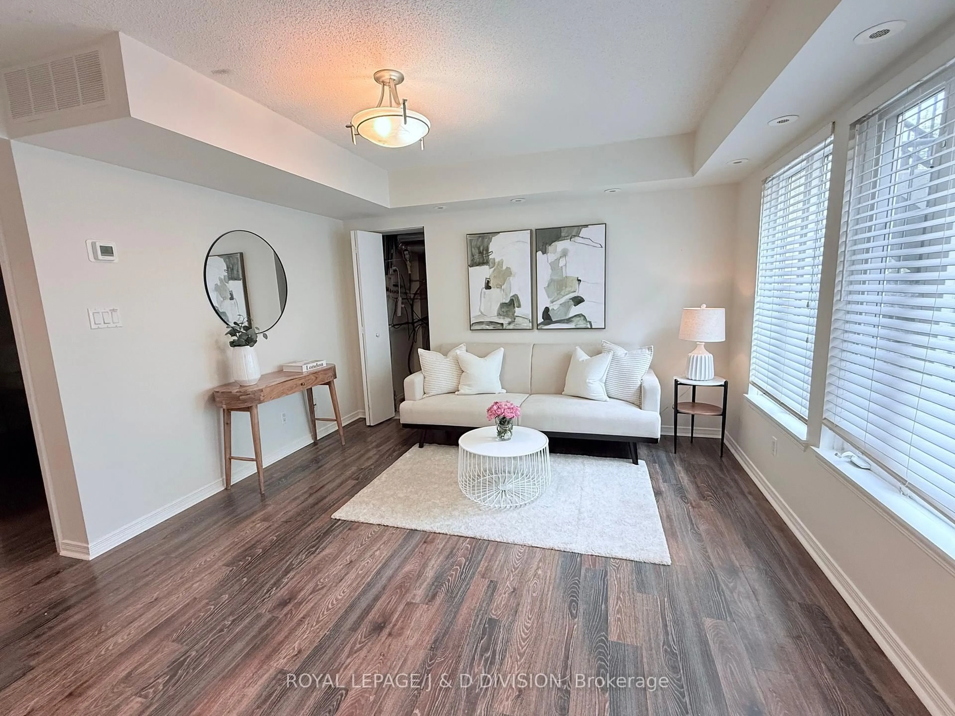 Living room with furniture, wood/laminate floor for 34 Western Battery Rd #402, Toronto Ontario M6K 3N9