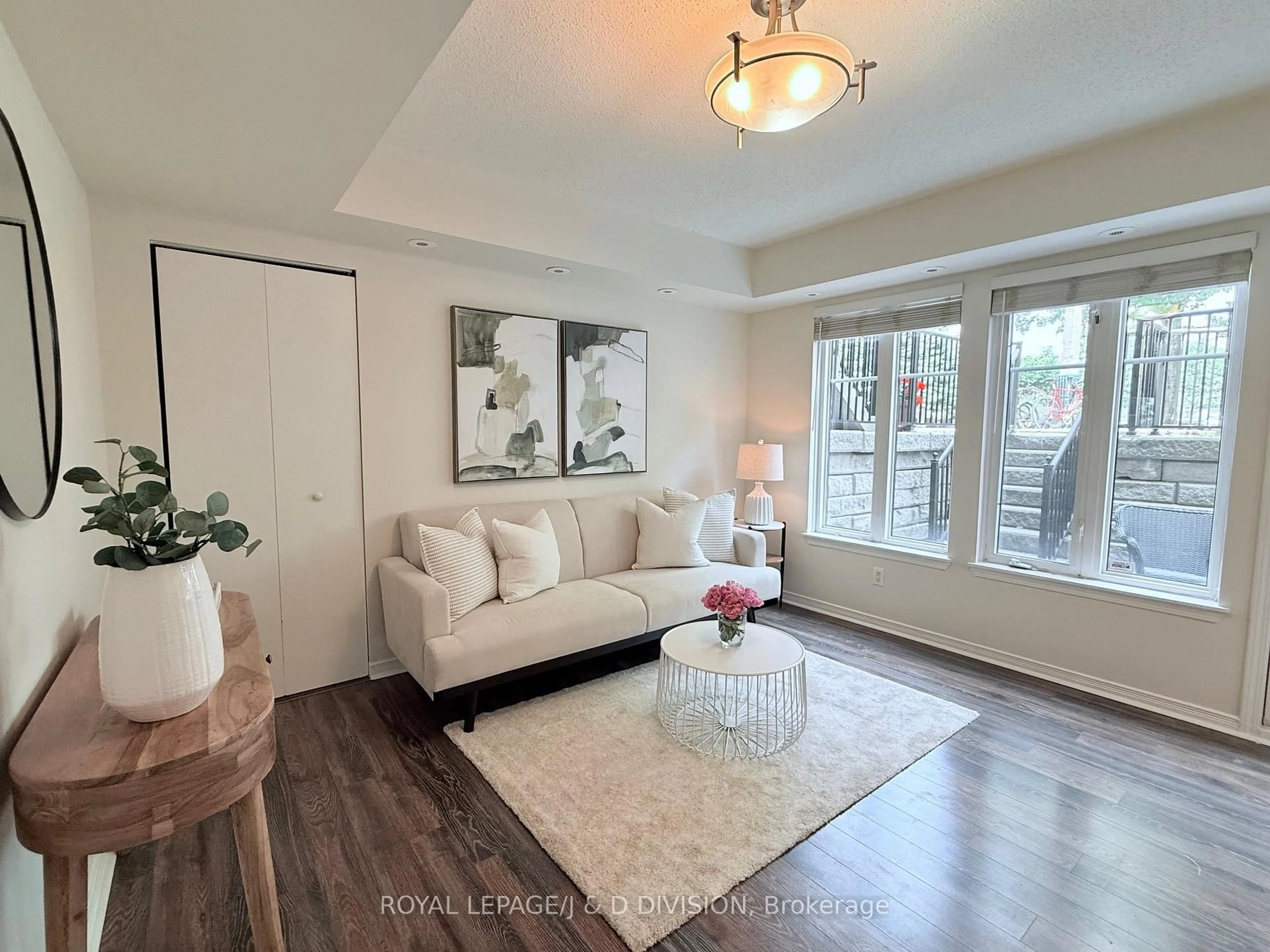 Living room with furniture, wood/laminate floor for 34 Western Battery Rd #402, Toronto Ontario M6K 3N9