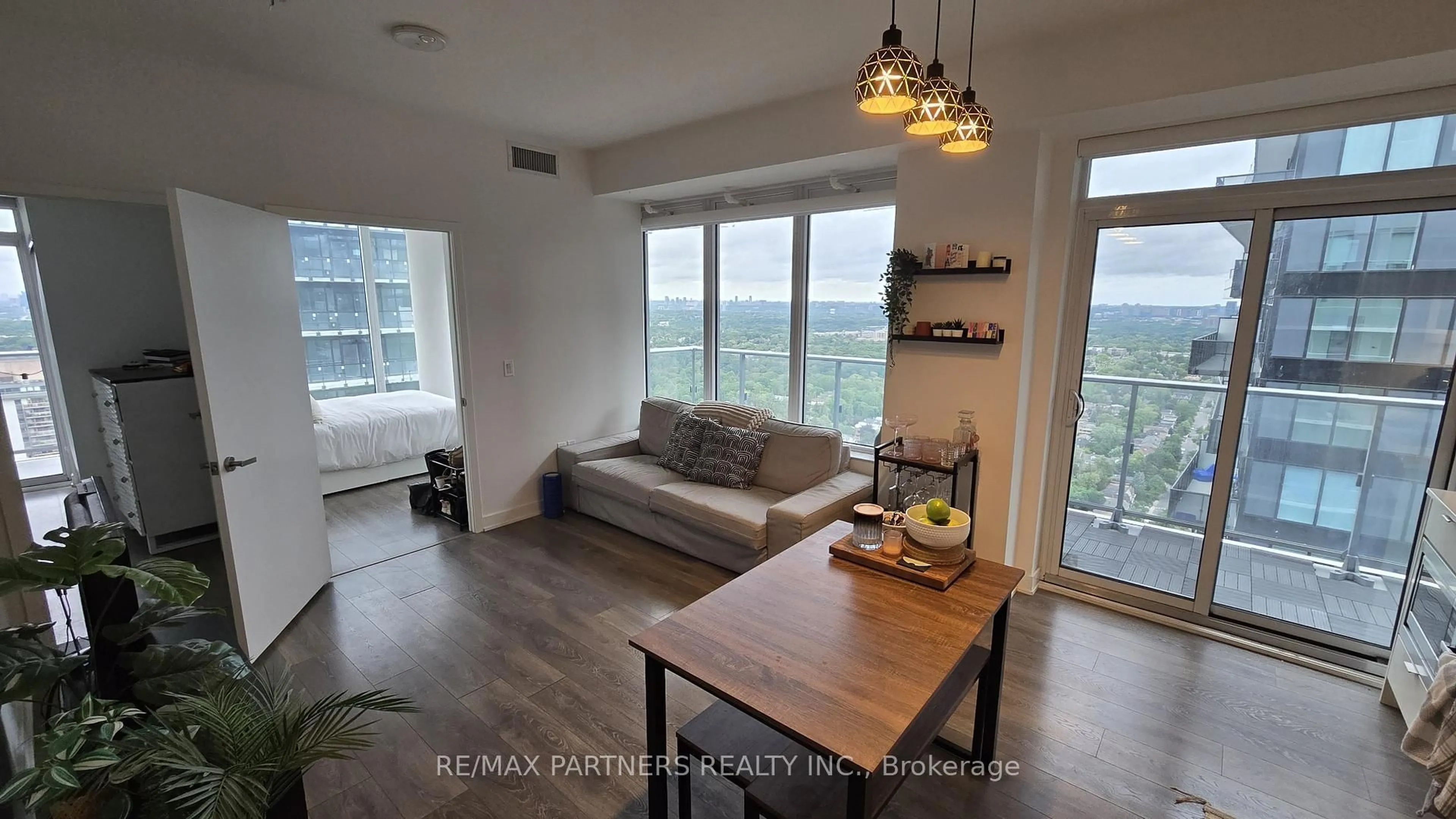 Living room with furniture, wood/laminate floor for 99 Broadway Ave #LPH03, Toronto Ontario M4P 0E3