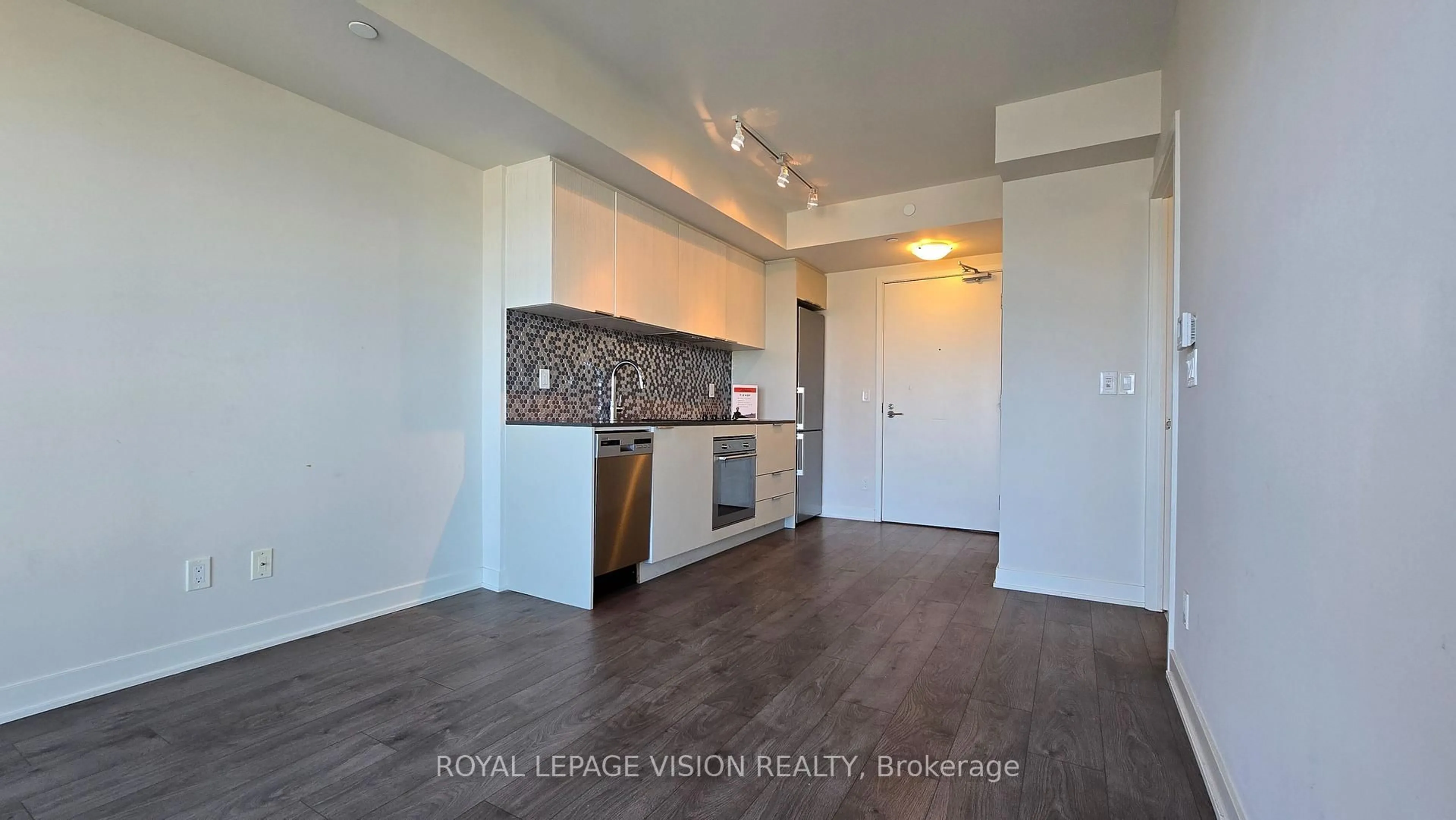 Open concept kitchen, wood/laminate floor for 2 Sonic Way #1909, Toronto Ontario M3C 0P2