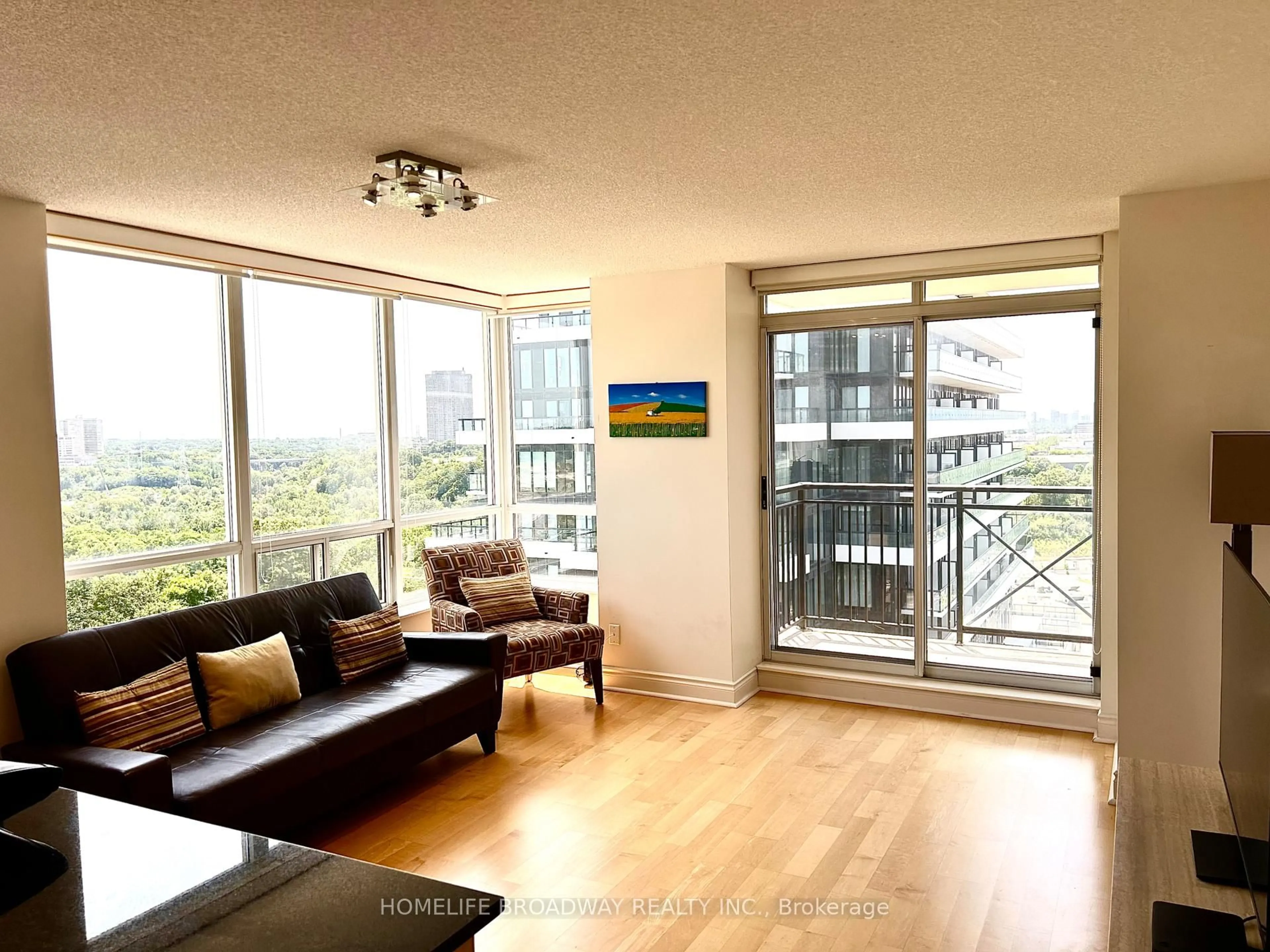 Living room with furniture, wood/laminate floor for 1103 Leslie St #1203, Toronto Ontario M3C 4G8