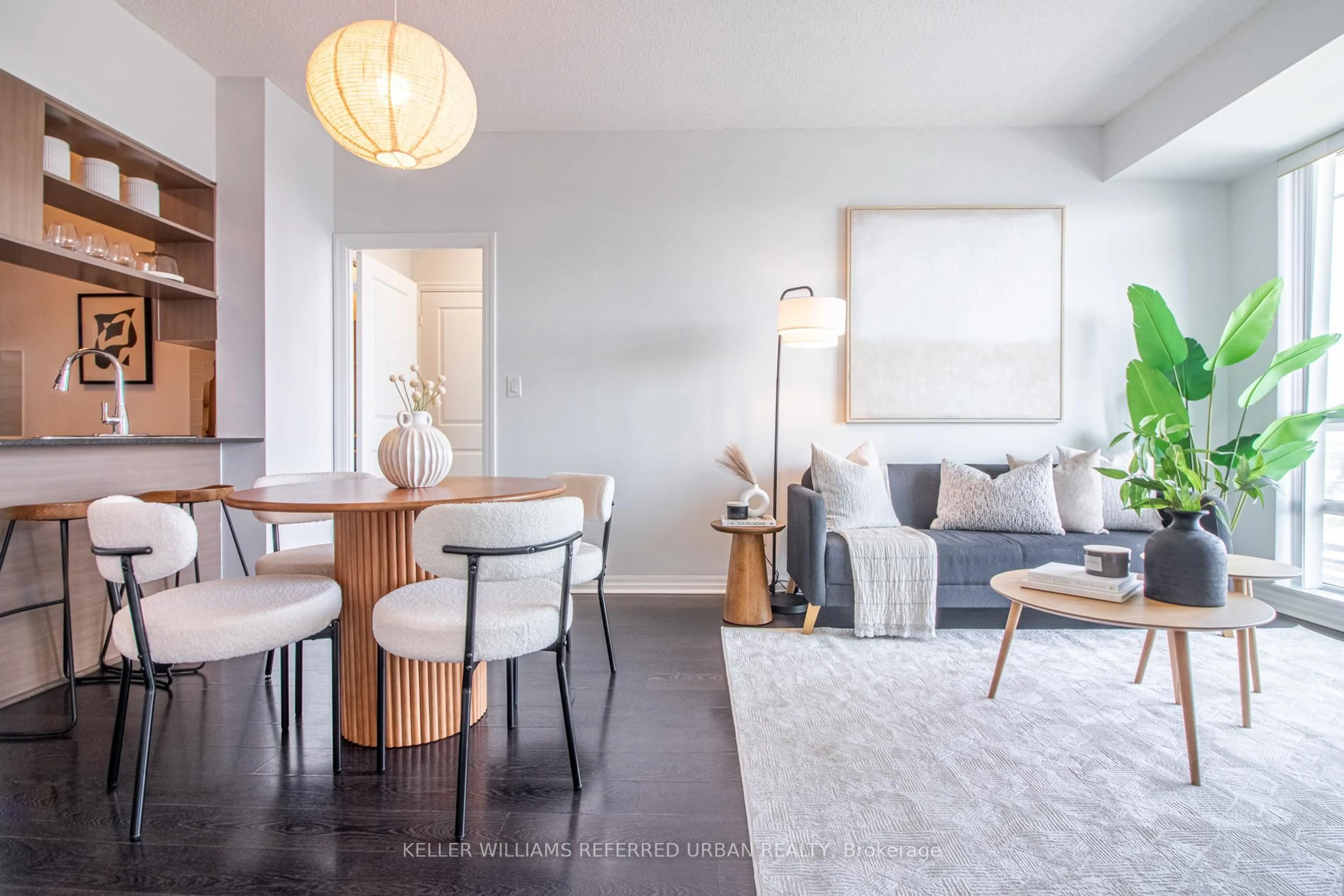 Living room with furniture, wood/laminate floor for 30 Herons Hill Way #2009, Toronto Ontario M2J 0A7