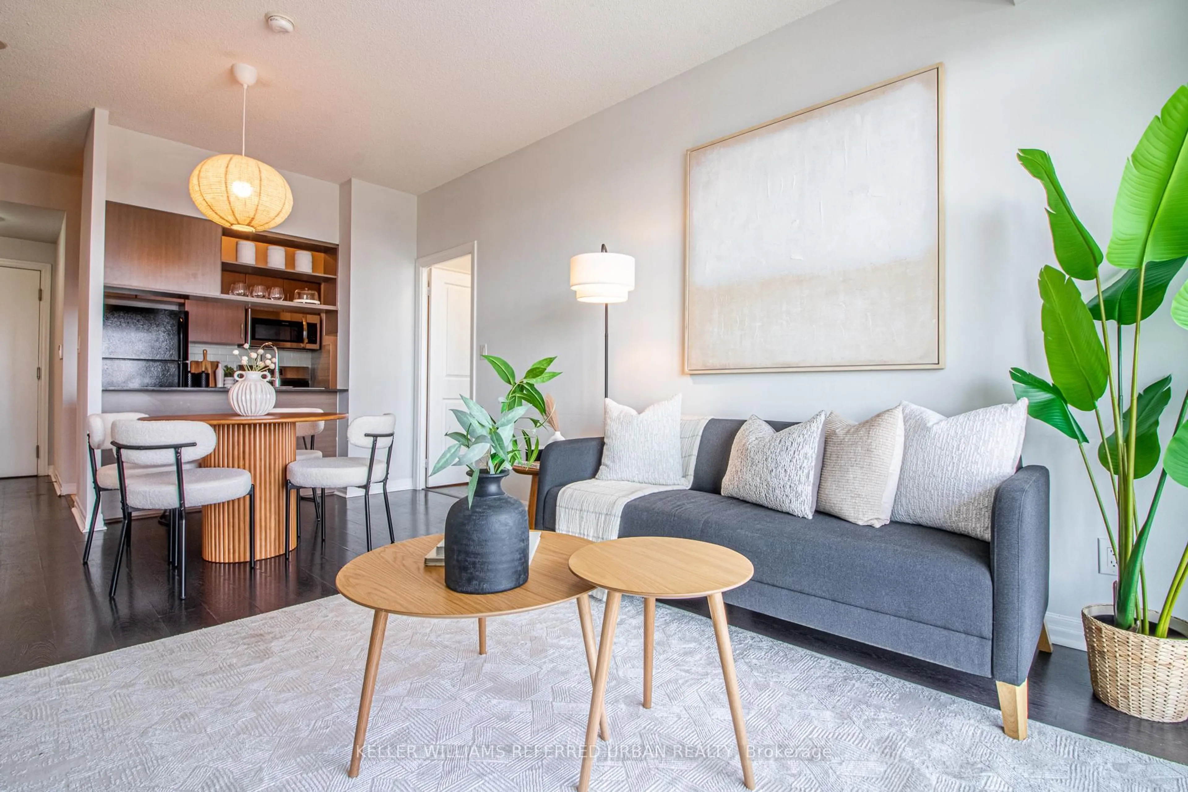 Living room with furniture, wood/laminate floor for 30 Herons Hill Way #2009, Toronto Ontario M2J 0A7