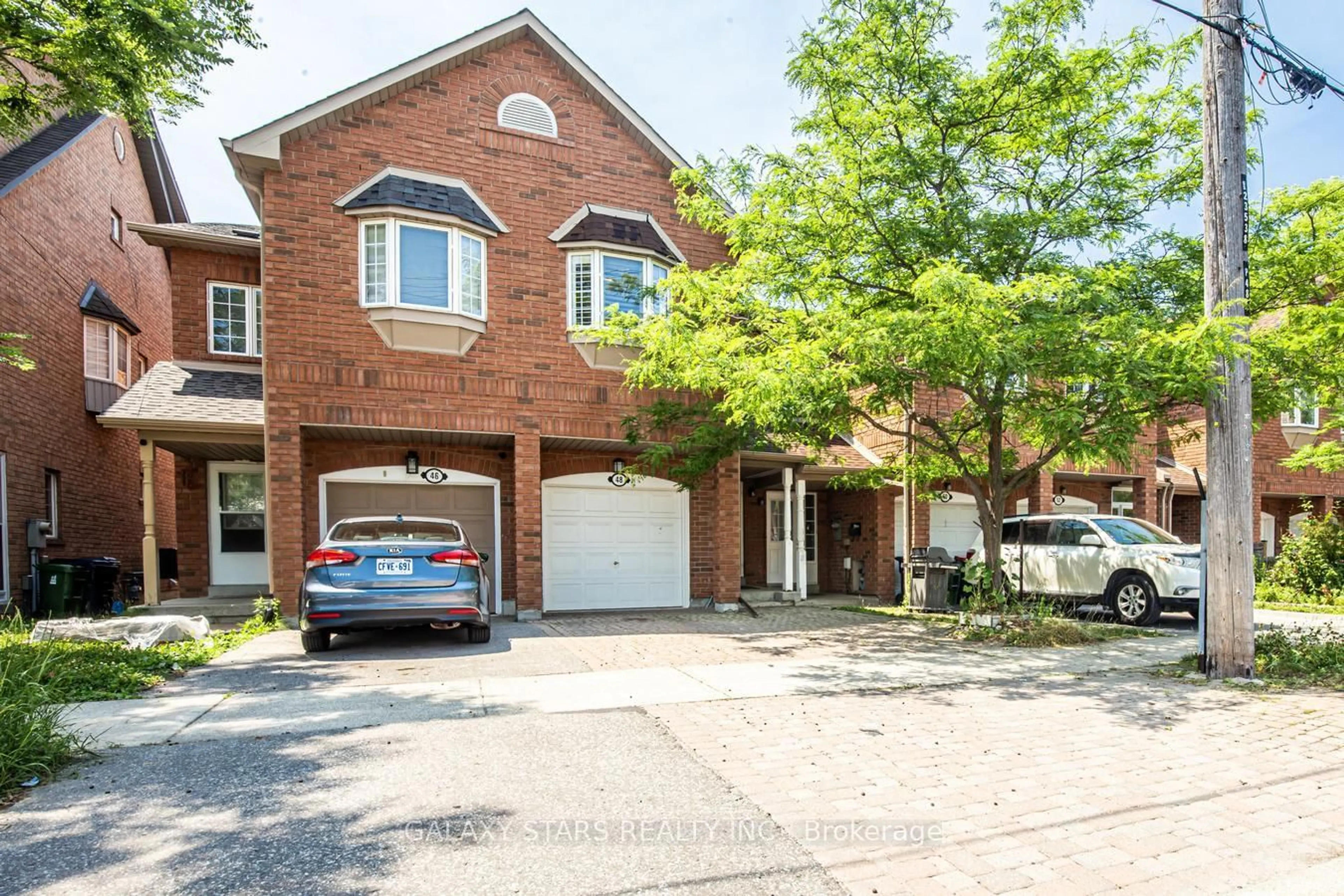 Home with brick exterior material, street for 48 Tisdale Ave, Toronto Ontario M4A 2Y3