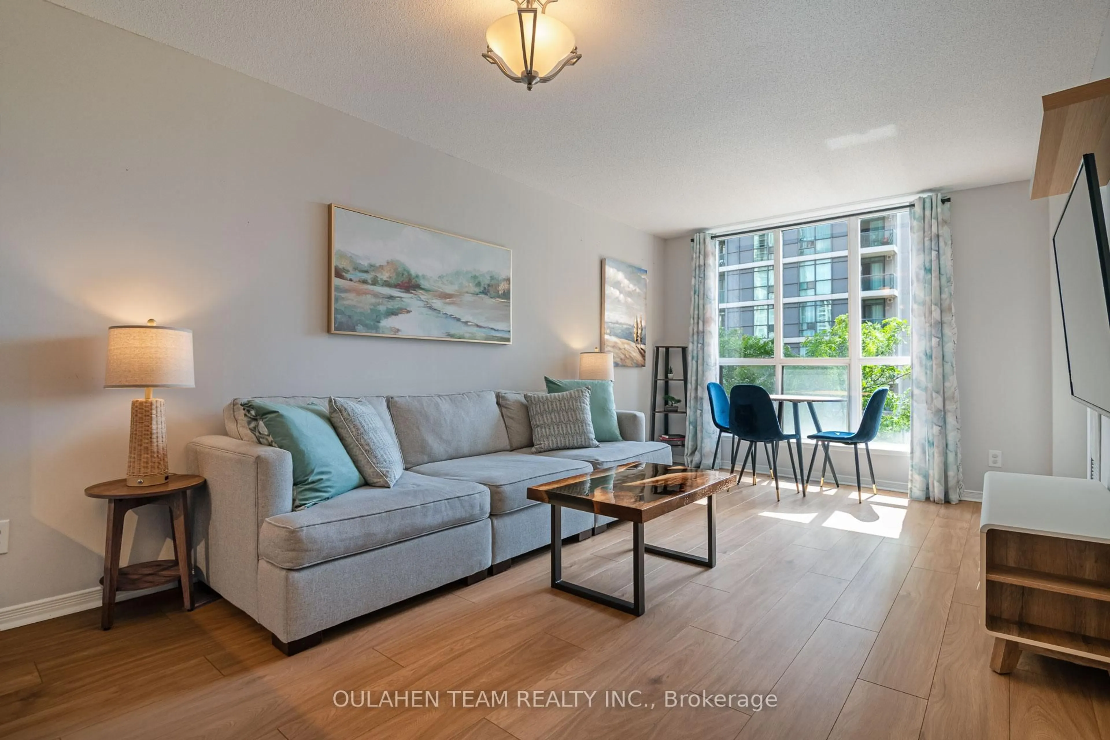 Living room with furniture, wood/laminate floor for 51 Harrison Garden Blvd #411, Toronto Ontario M2N 7G4