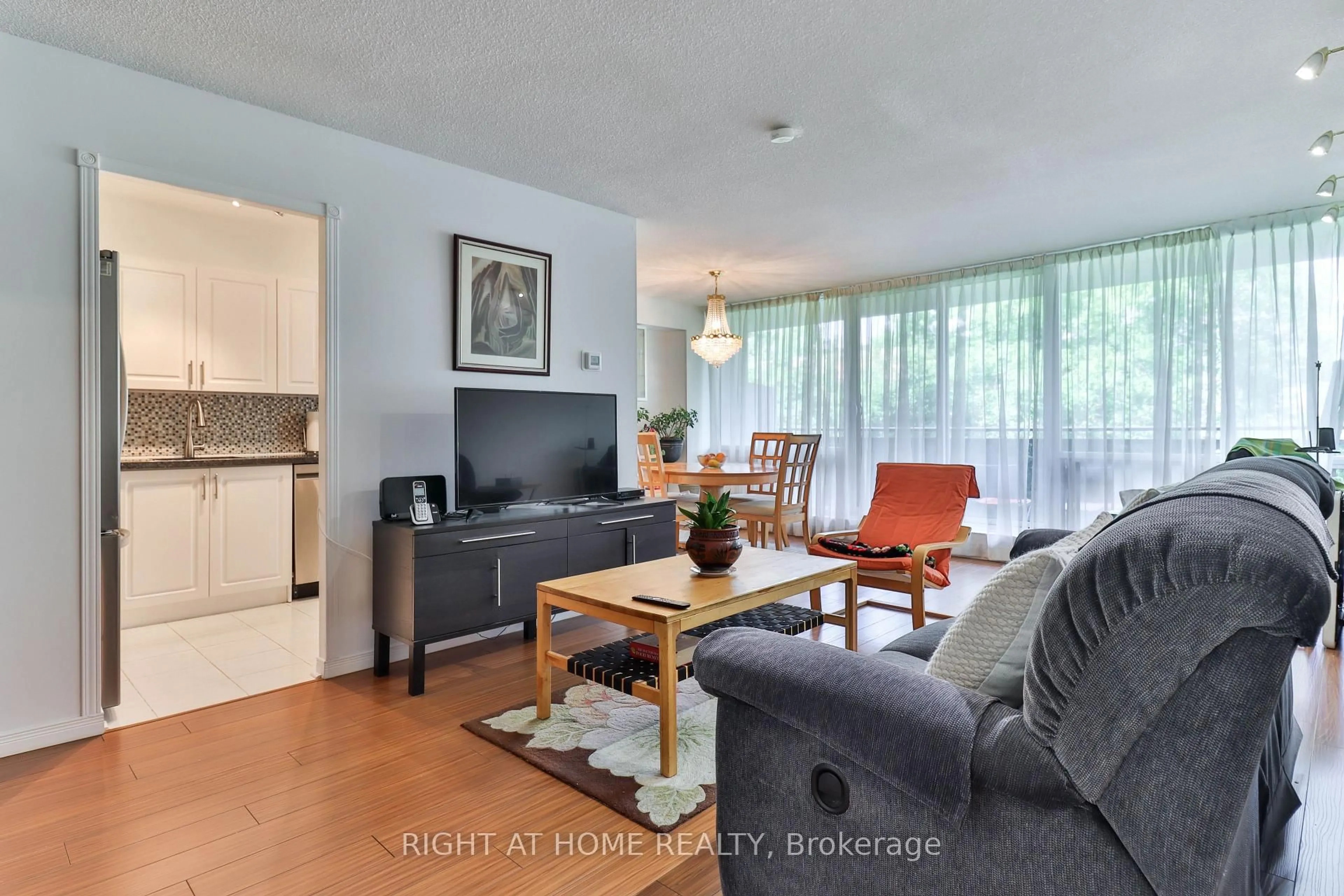 Living room with furniture, wood/laminate floor for 10 Sunrise Ave #313, Toronto Ontario M4A 2R1