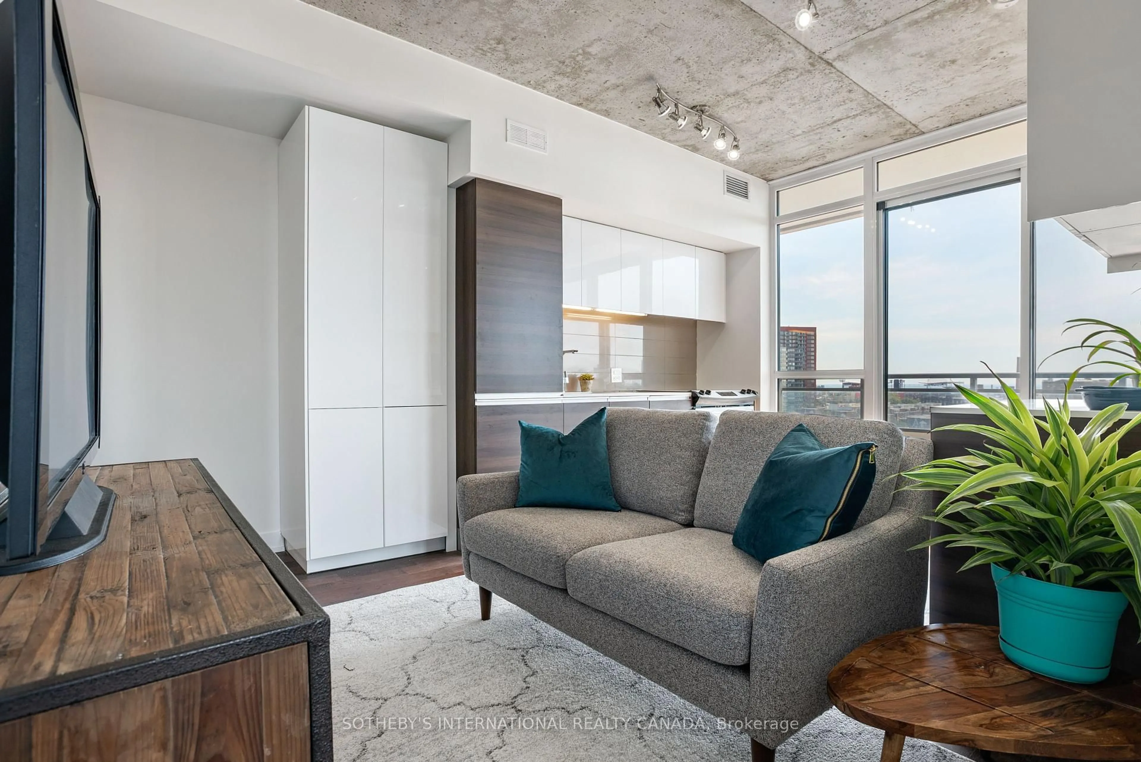 Living room with furniture, cement floor for 20 Minowan Miikan Lane #907, Toronto Ontario M6J 0E5