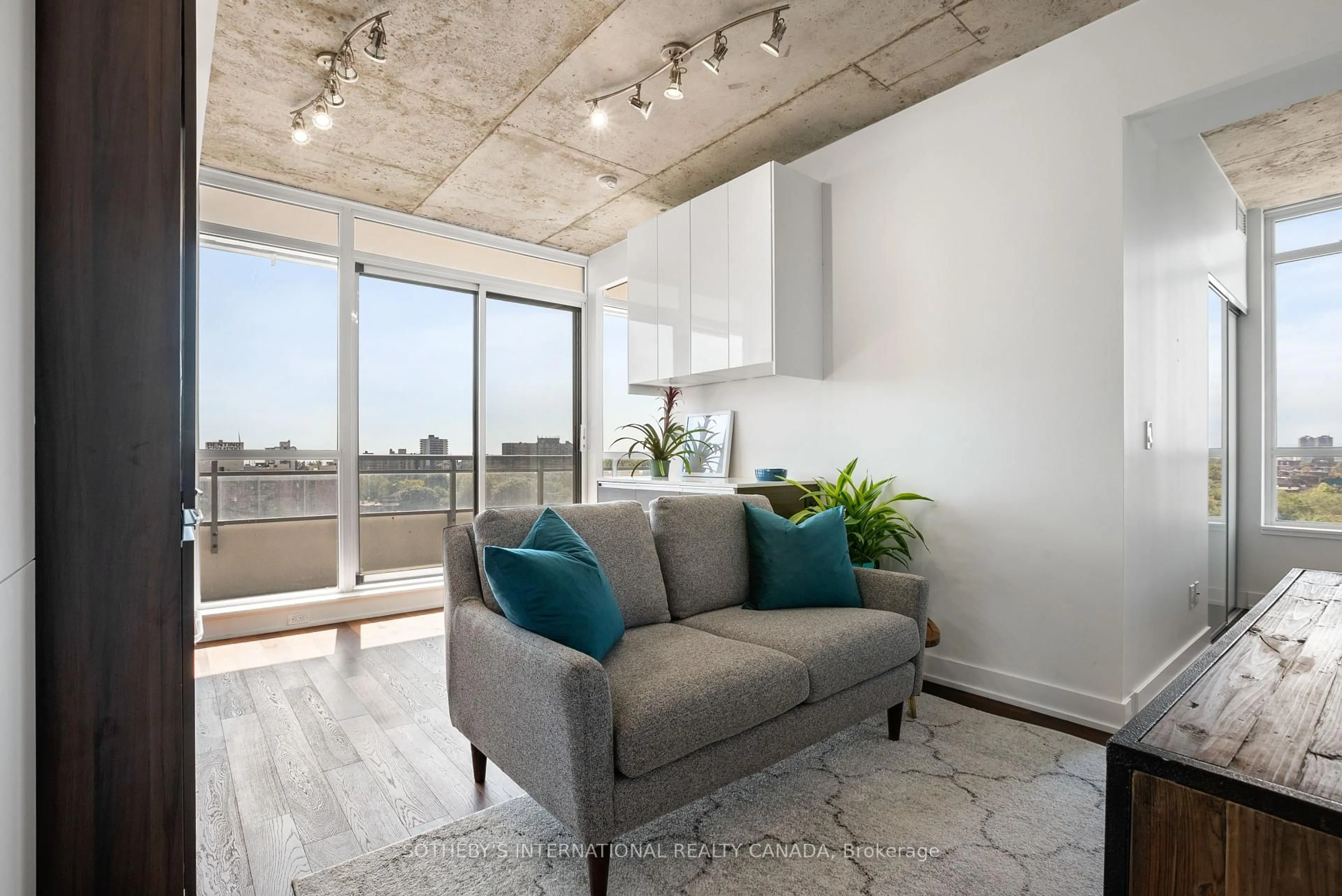 Living room with furniture, cement floor for 20 Minowan Miikan Lane #907, Toronto Ontario M6J 0E5