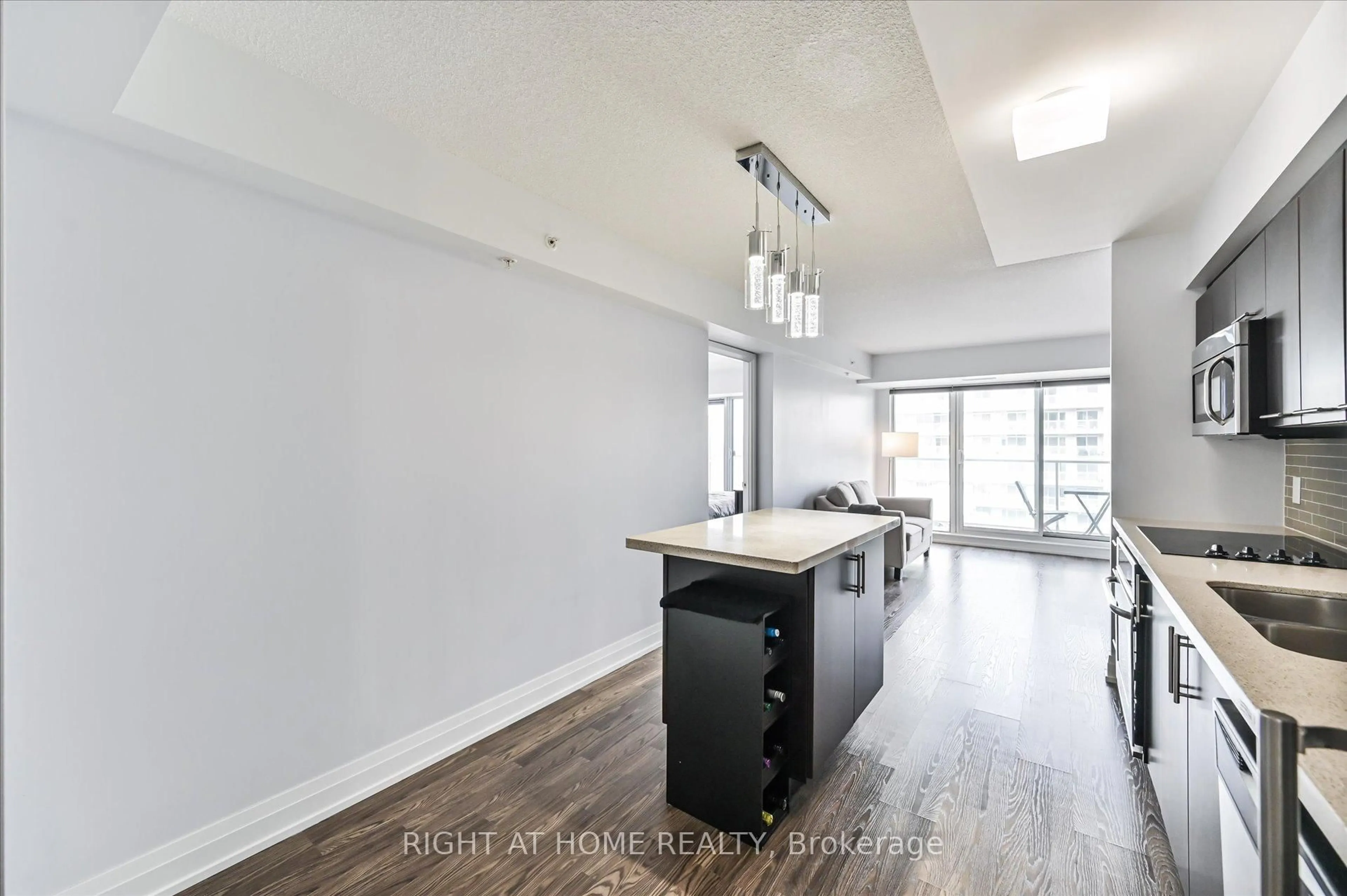 Open concept kitchen, wood/laminate floor for 565 Wilson Ave #W1001, Toronto Ontario M3H 0C6