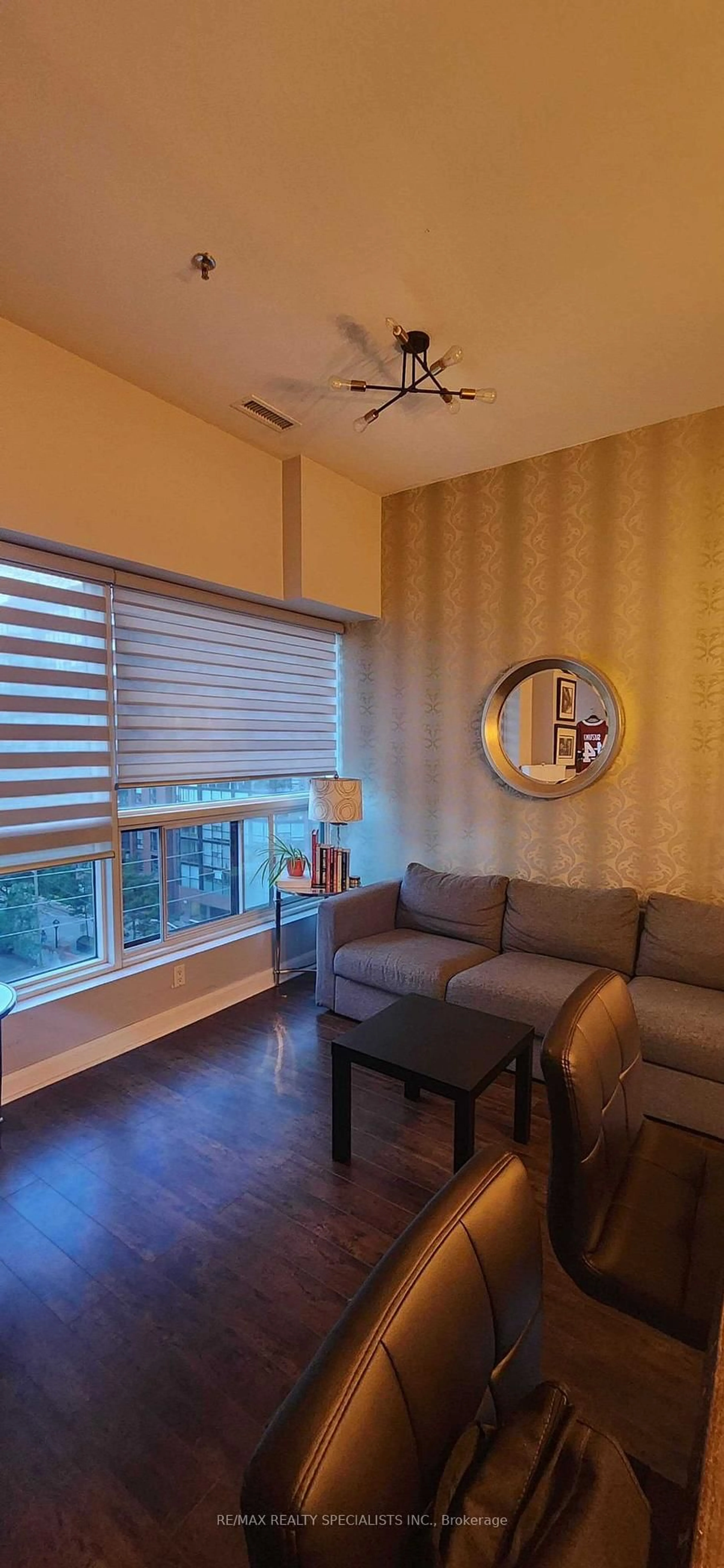 Living room with furniture, wood/laminate floor for 700 King St #519, Toronto Ontario M5V 2Y6