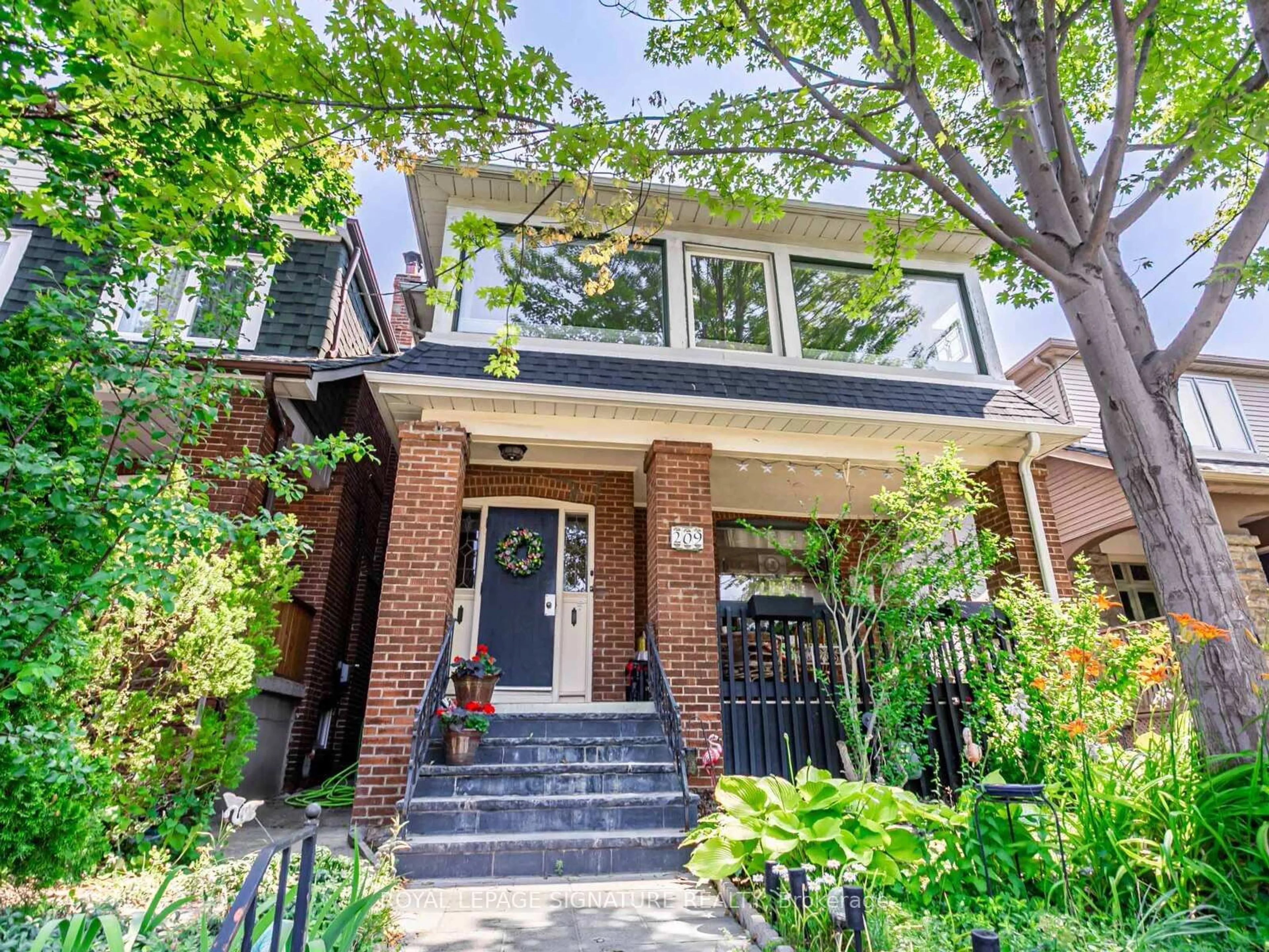 Home with brick exterior material, street for 209 Arlington Ave, Toronto Ontario M6C 2Z4