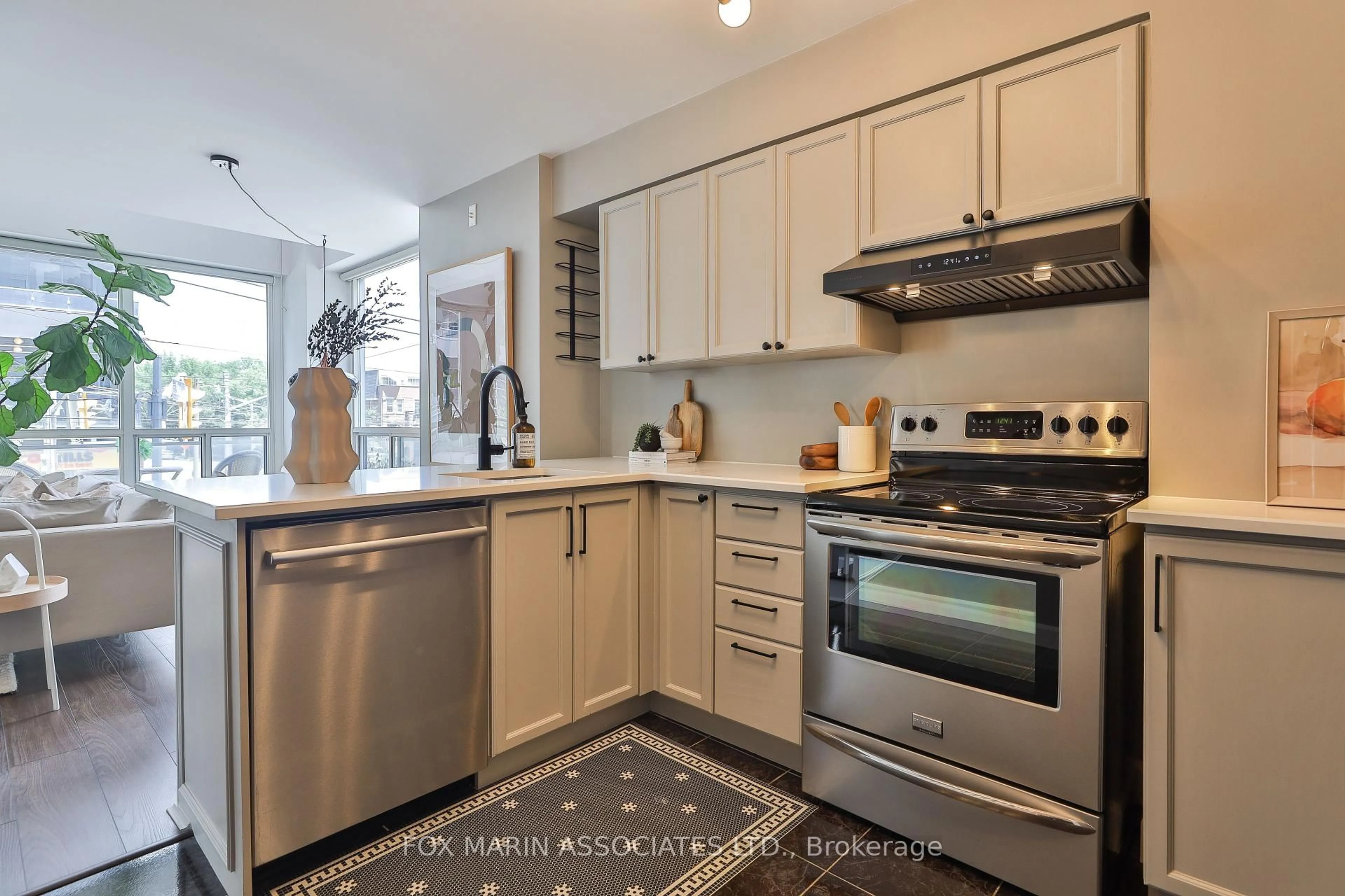 Open concept kitchen, ceramic/tile floor for 1029 King St #230, Toronto Ontario M6K 3M9