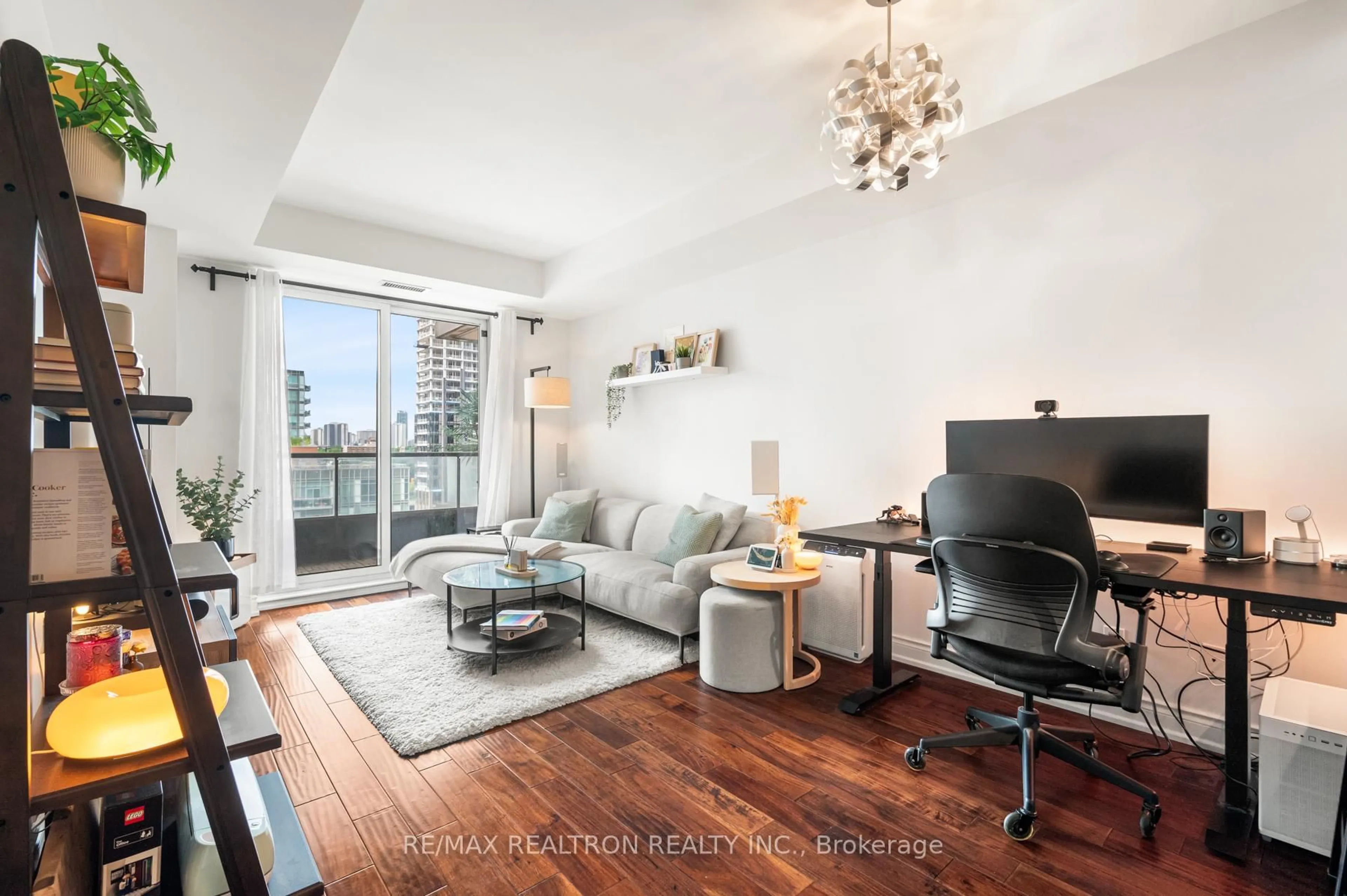 Living room with furniture, wood/laminate floor for 168 King St #1111, Toronto Ontario M5A 4S4