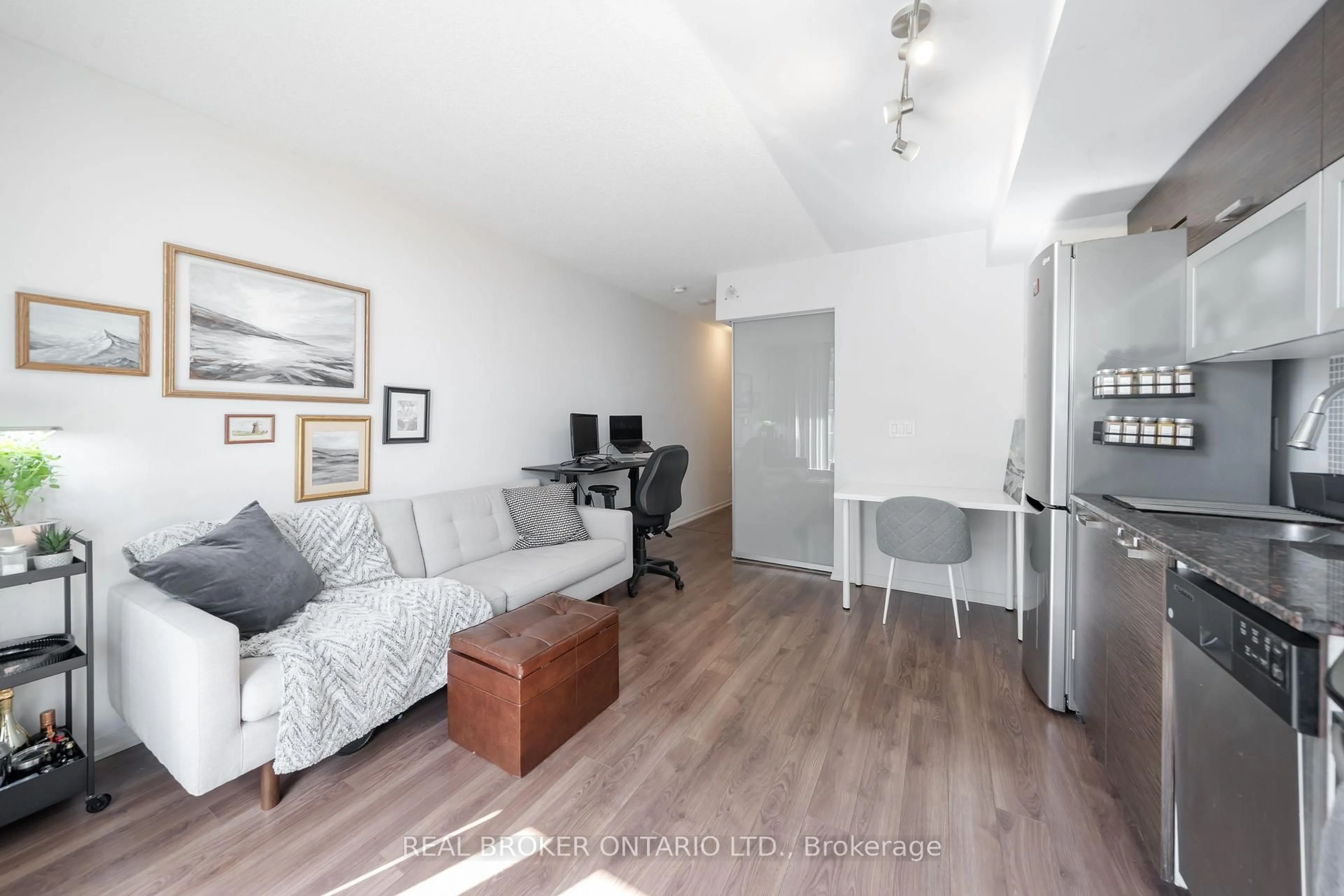 Living room with furniture, wood/laminate floor for 36 Lisgar St #908E, Toronto Ontario M6J 3G2