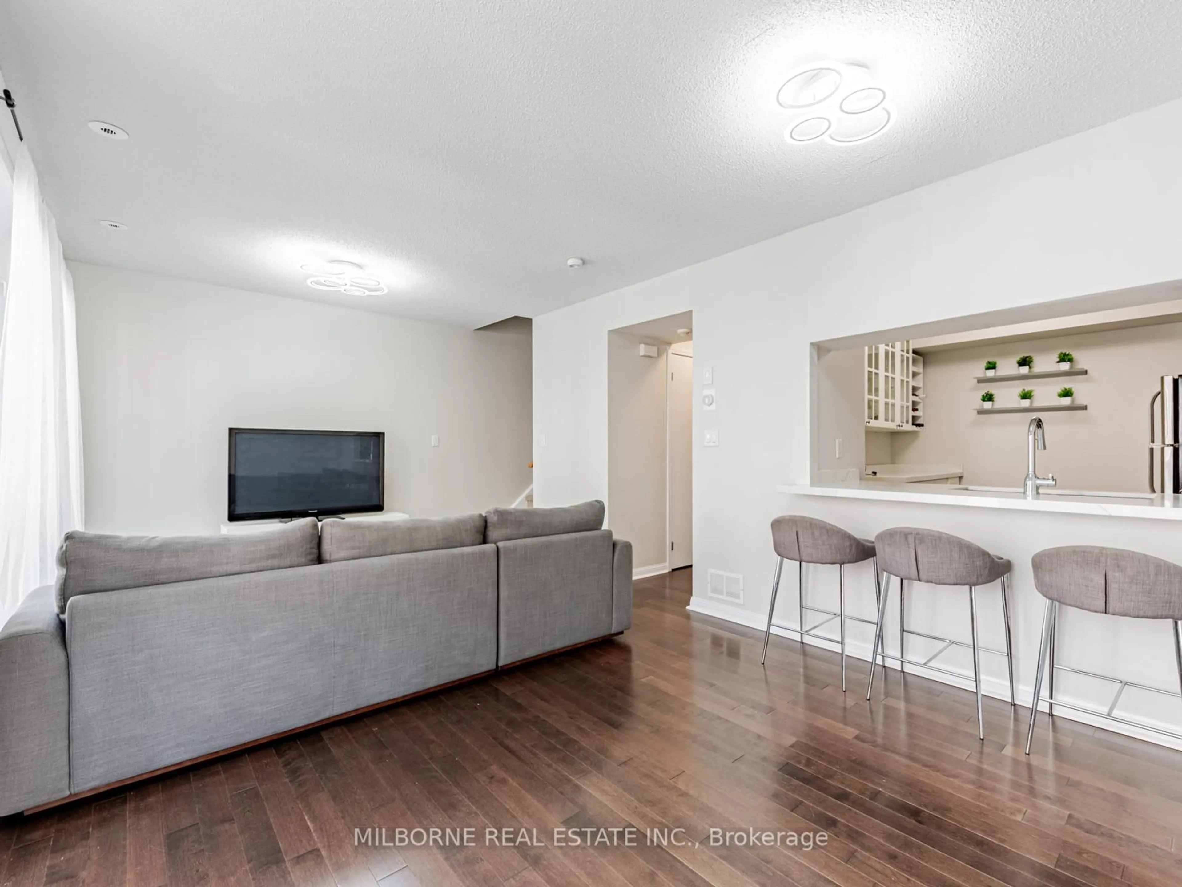 Living room with furniture, wood/laminate floor for 3 Everson Dr #303, Toronto Ontario M2N 7C2