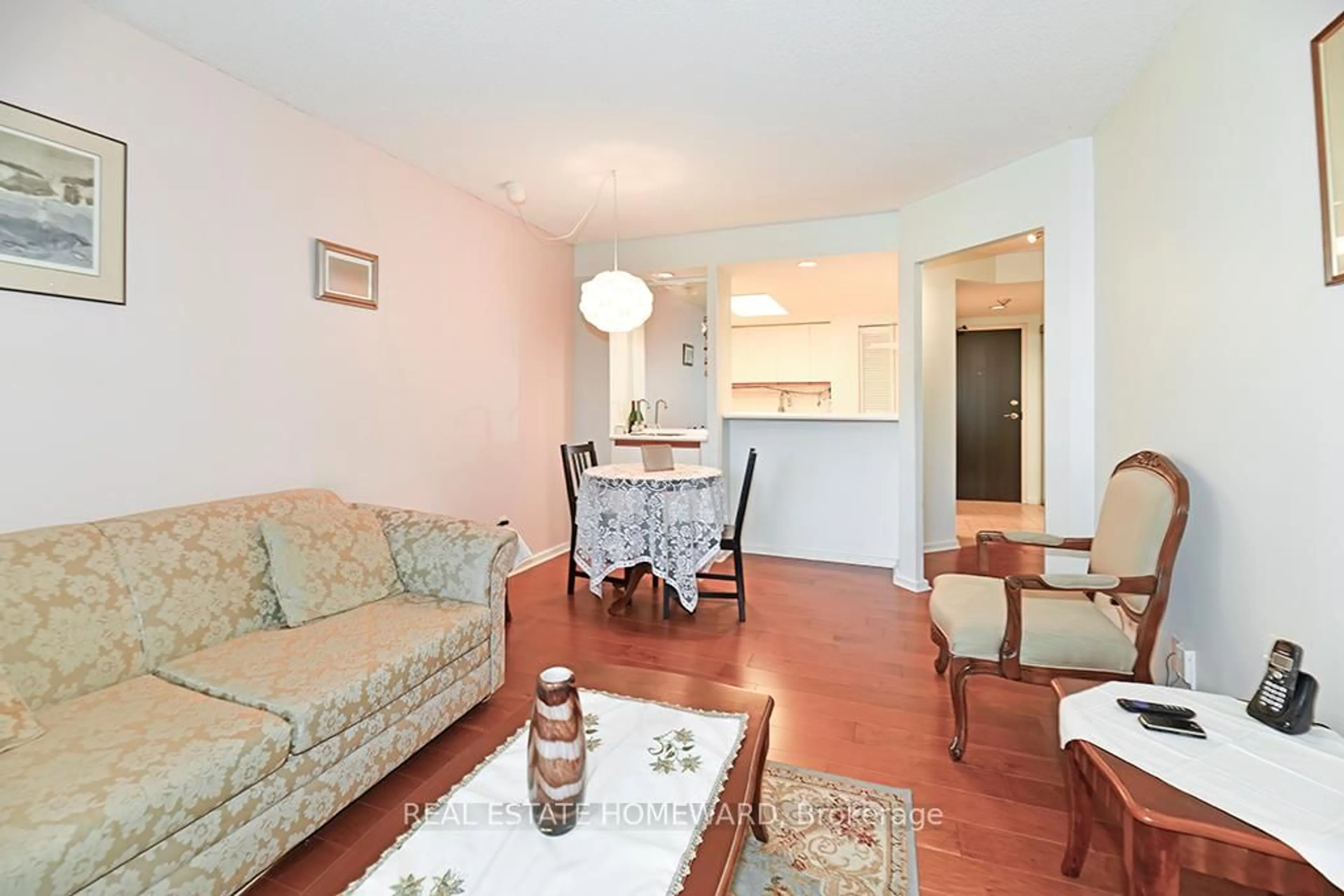 Living room with furniture, wood/laminate floor for 15 Maitland Pl #204, Toronto Ontario M4Y 2X3