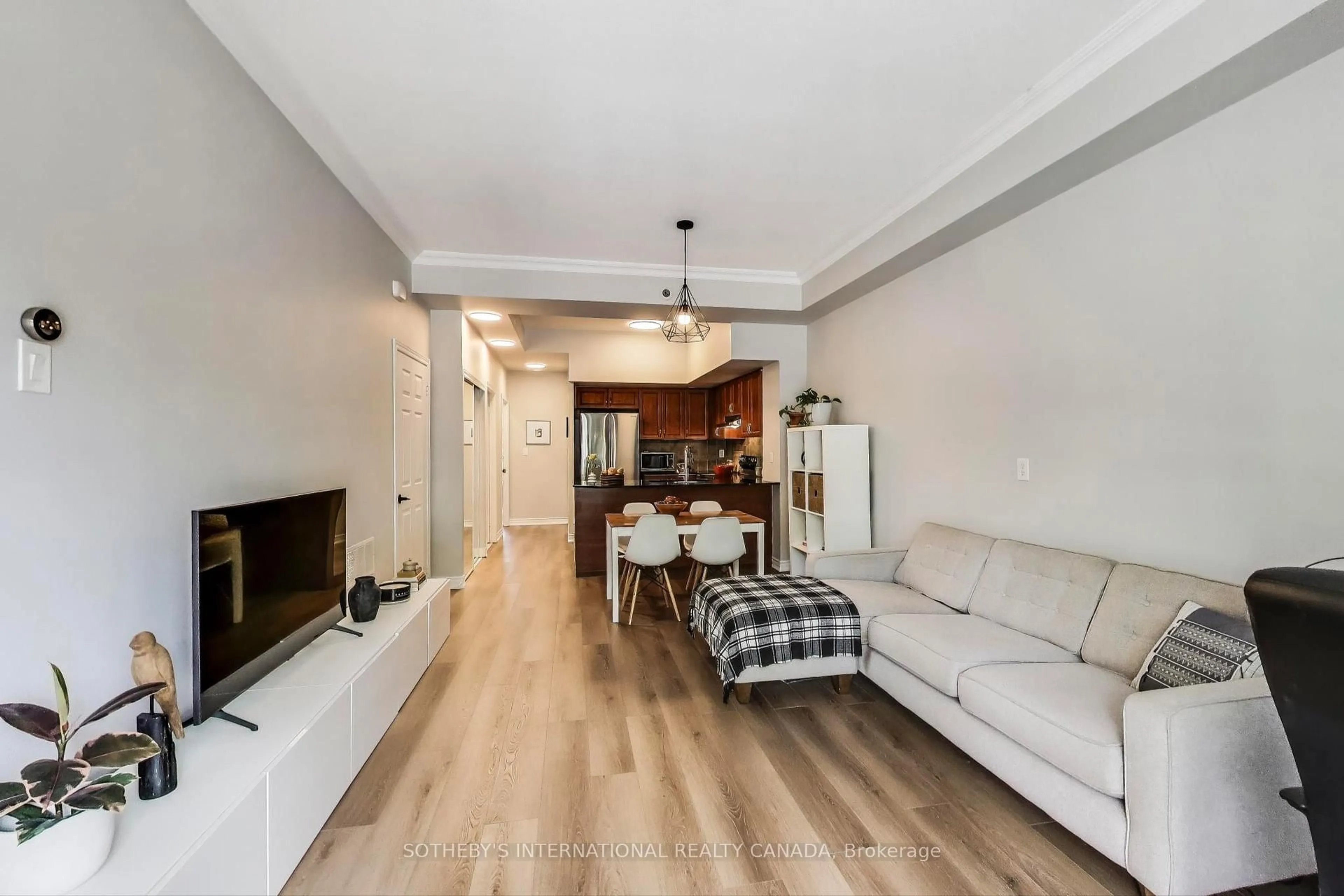 Living room with furniture, wood/laminate floor for 207 Wellesley St #207, Toronto Ontario M4X 1G1