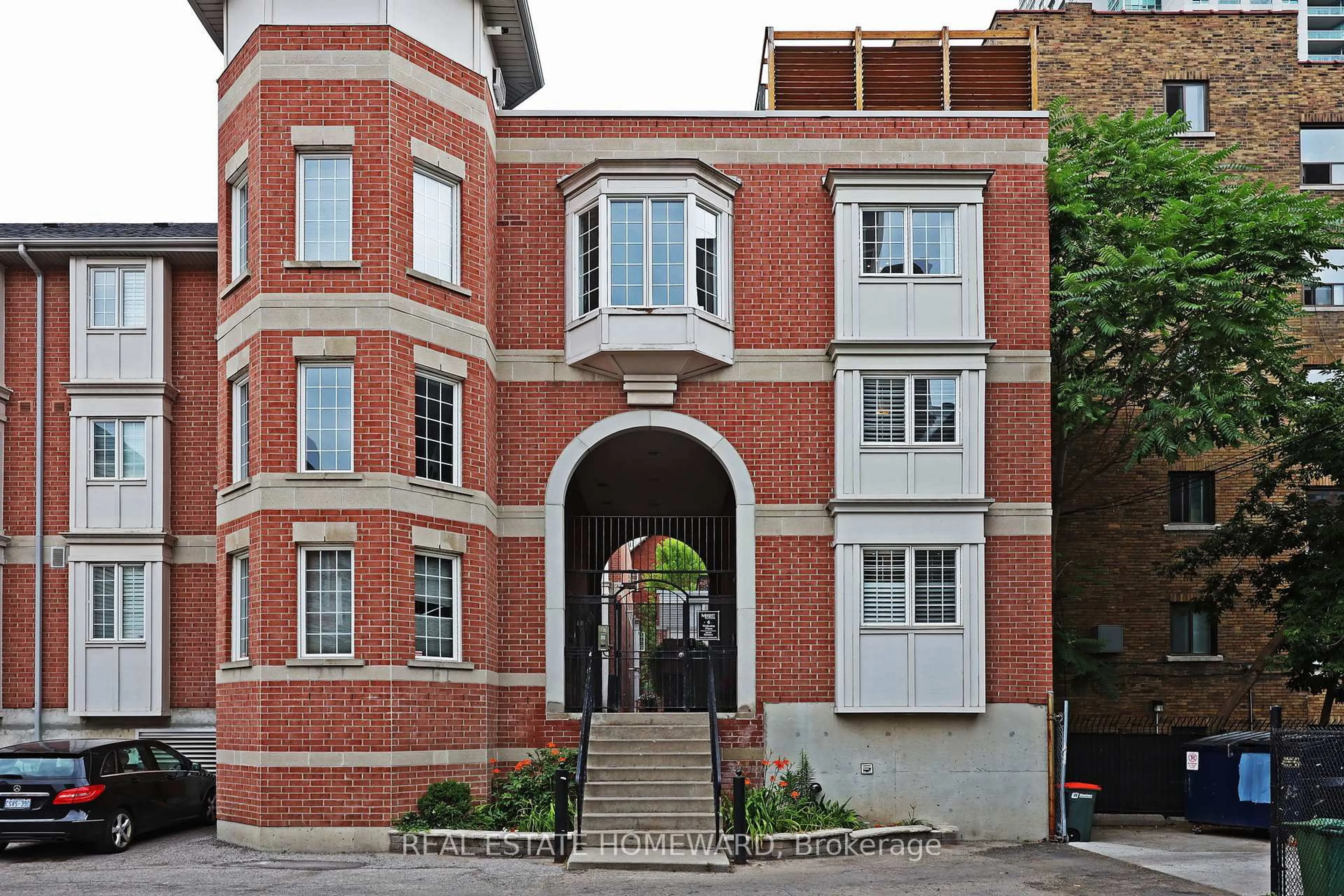 Home with brick exterior material, building for 6 Wellesley Pl #30, Toronto Ontario M4Y 3E1