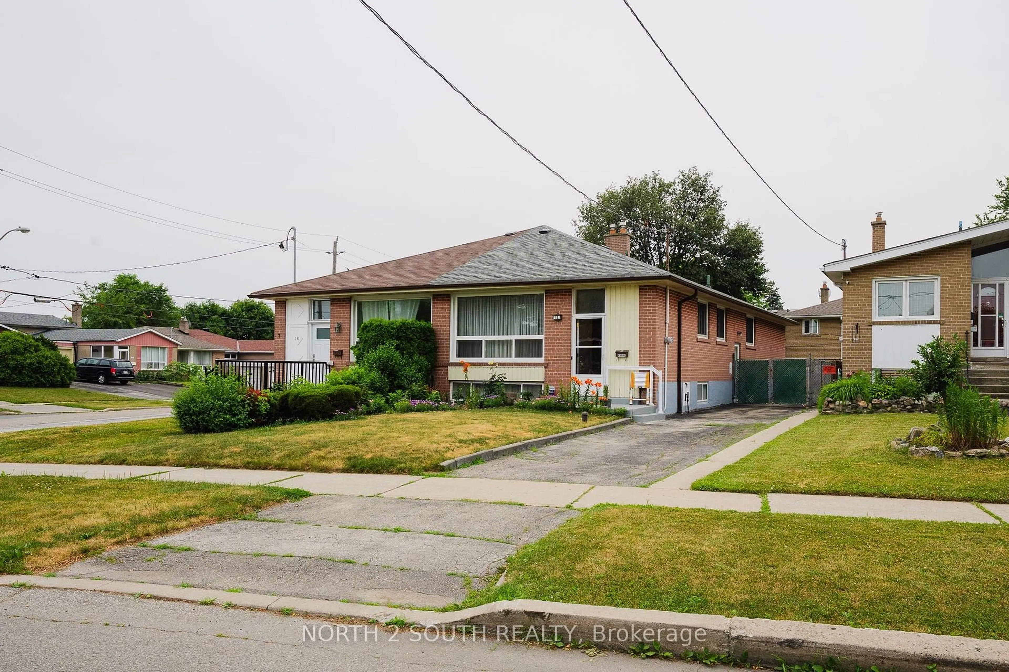 Home with brick exterior material, street for 12 Roywood Dr, Toronto Ontario M3A 2C6