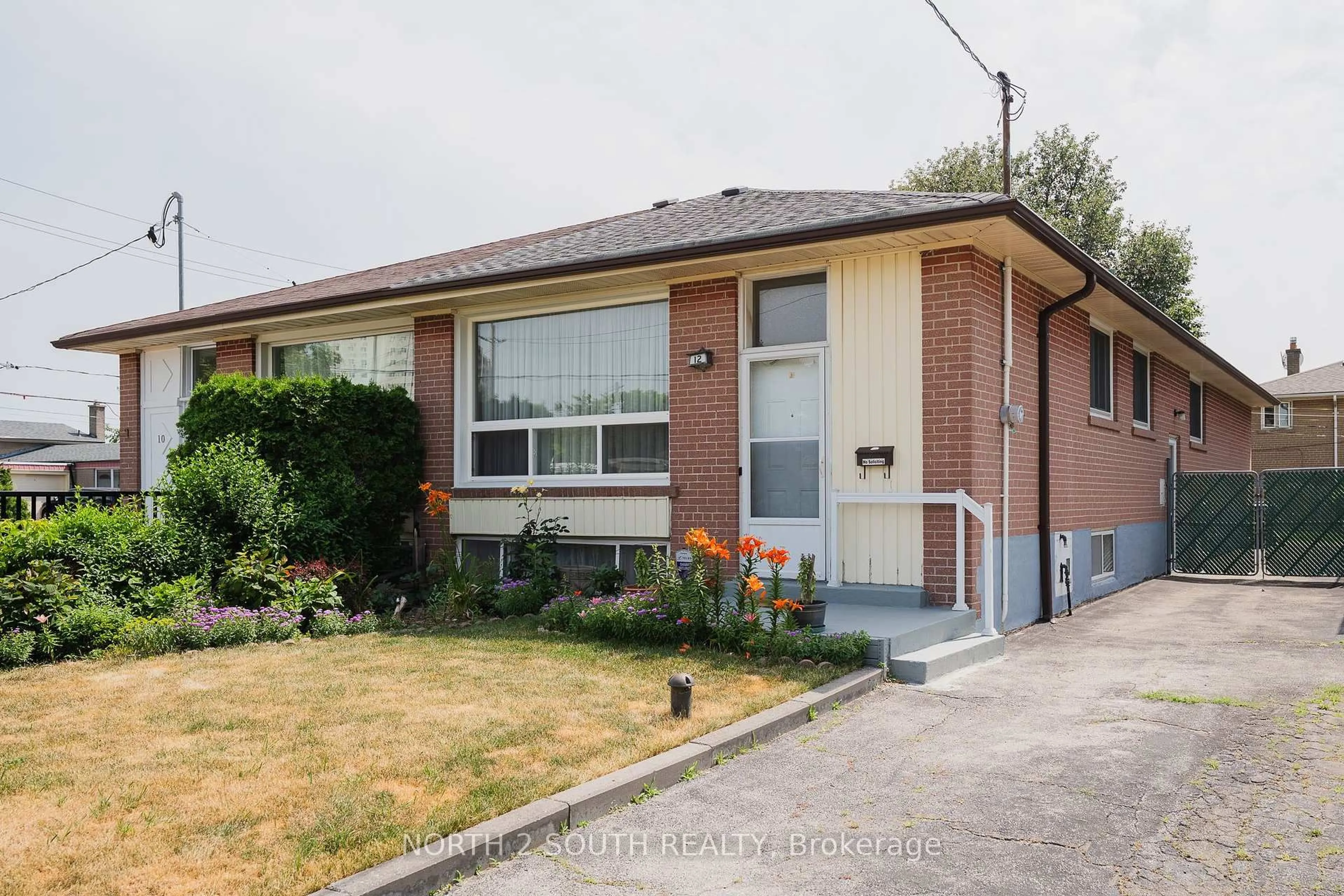 Home with brick exterior material, street for 12 Roywood Dr, Toronto Ontario M3A 2C6