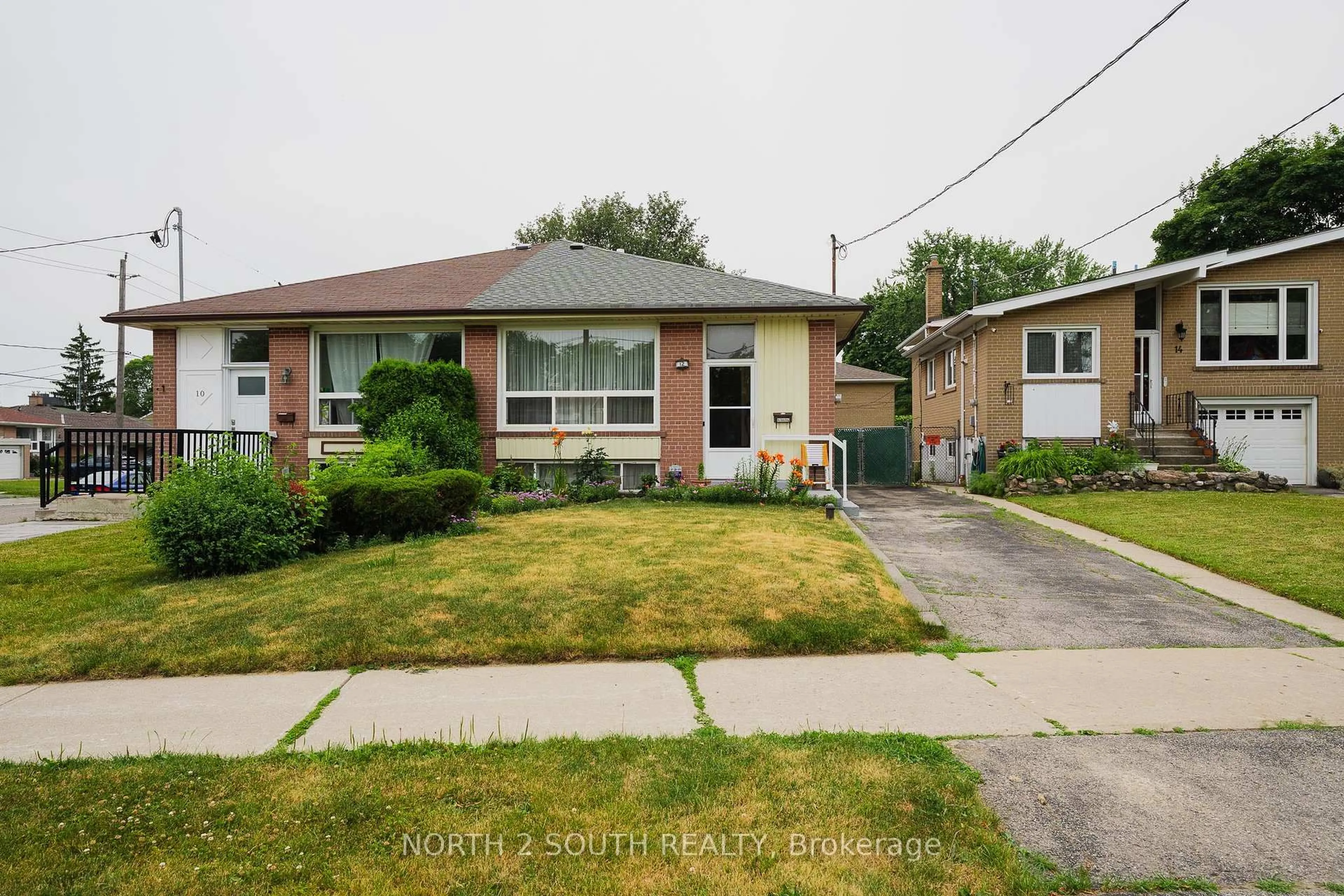 Home with brick exterior material, street for 12 Roywood Dr, Toronto Ontario M3A 2C6