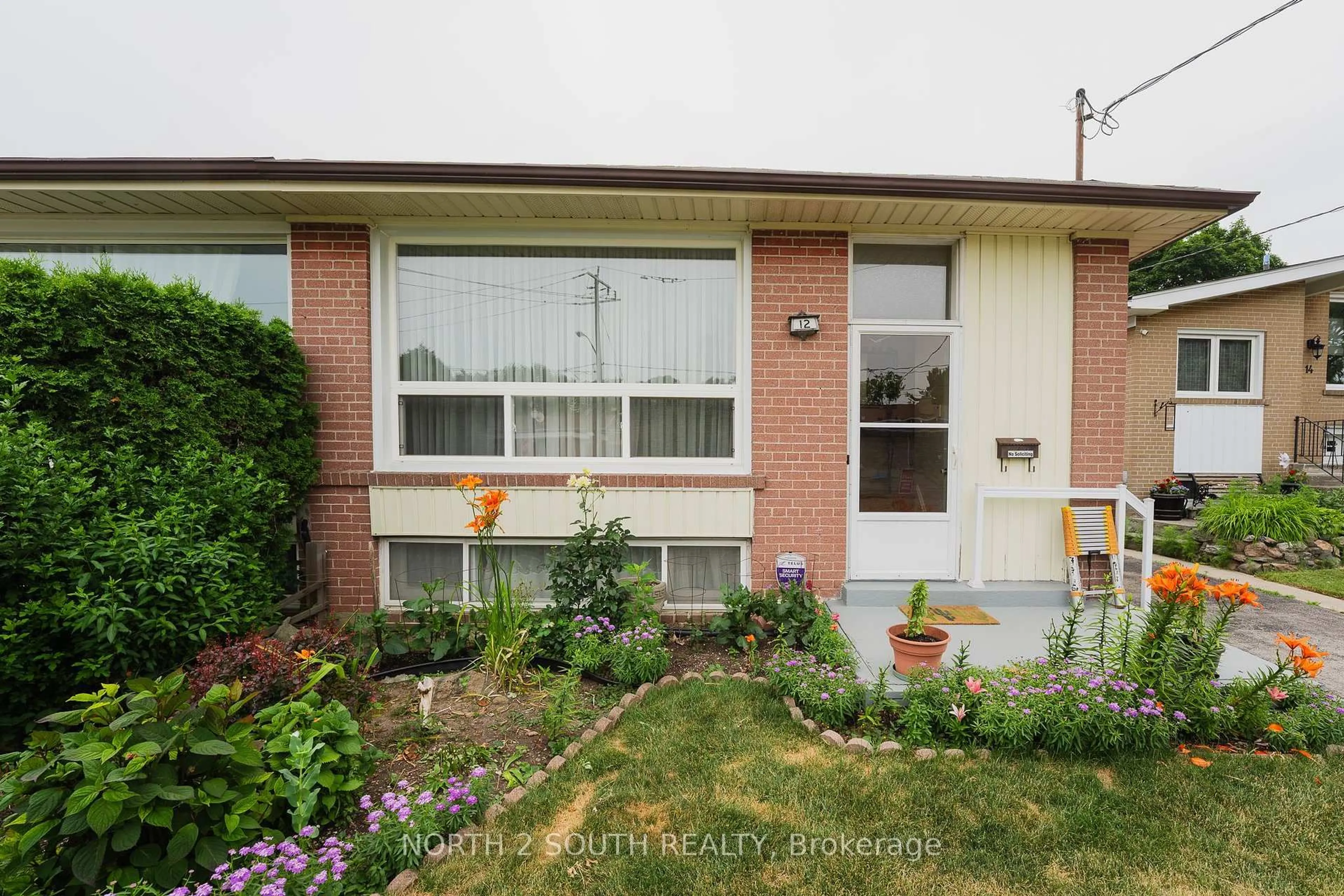 Home with brick exterior material, street for 12 Roywood Dr, Toronto Ontario M3A 2C6