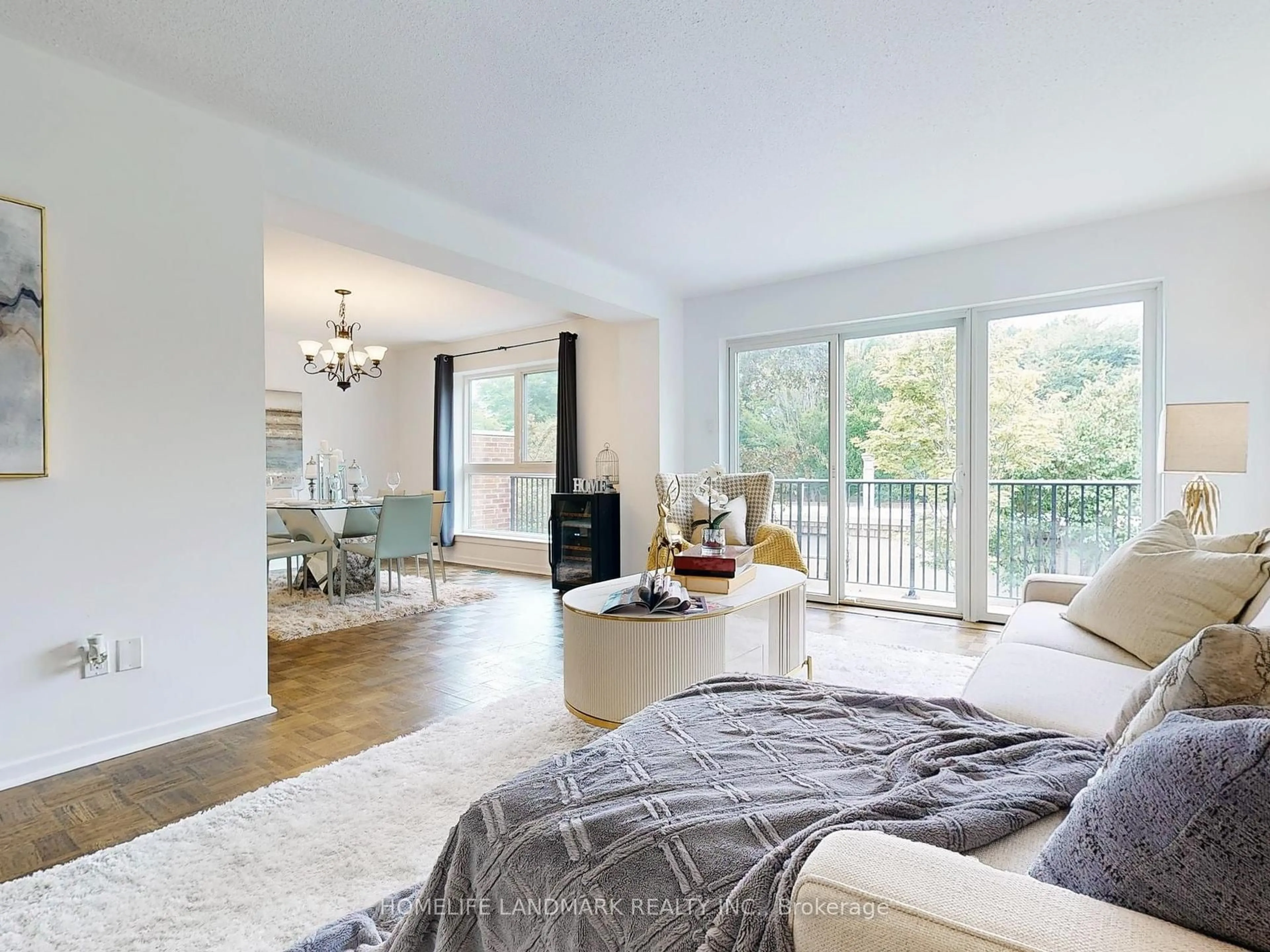 Living room with furniture, wood/laminate floor for 26 Anvil Mill Way, Toronto Ontario M2L 1R1