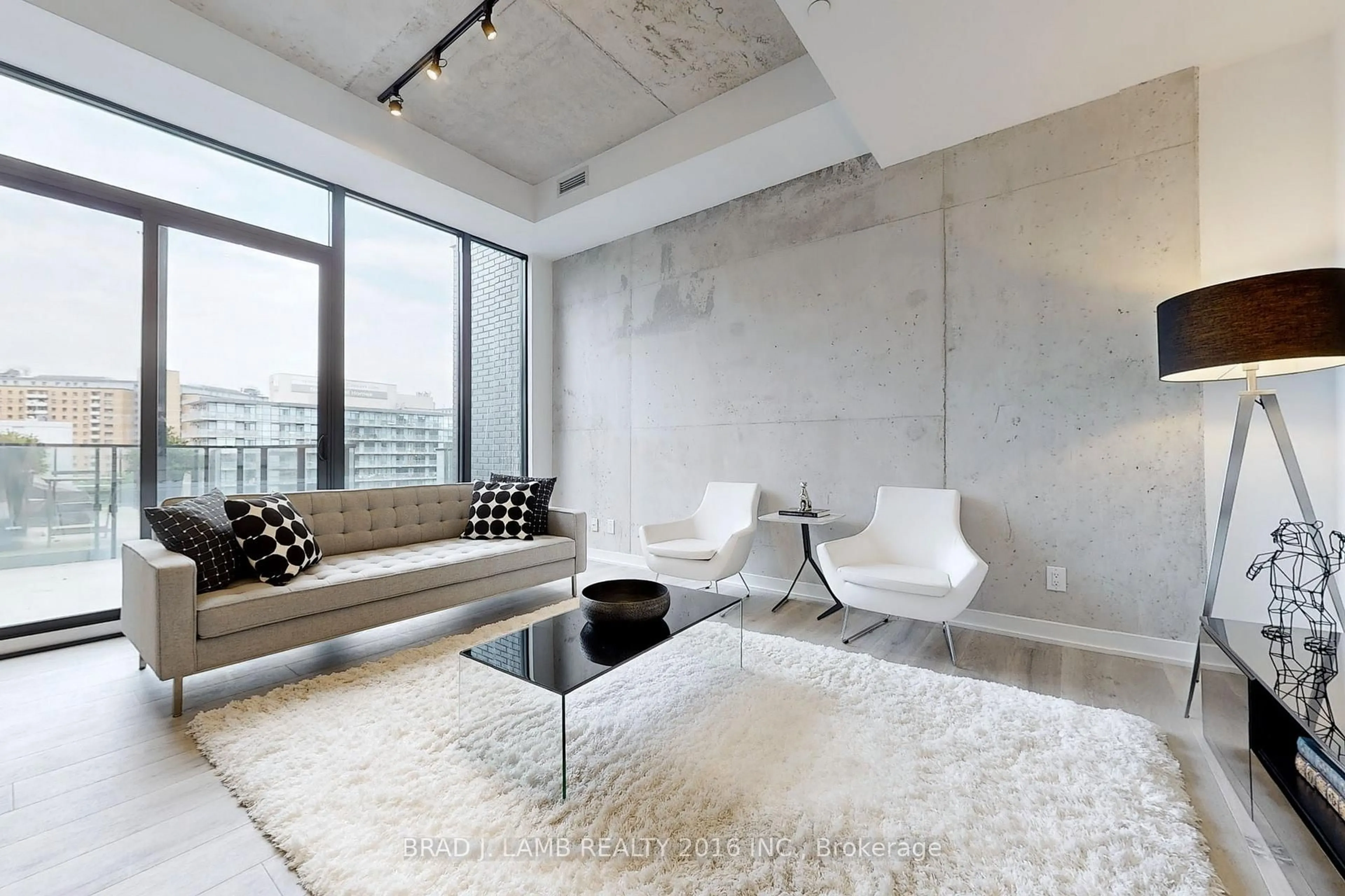 Living room with furniture, cement floor for 55 Ontario St #321, Toronto Ontario M5A 0T8