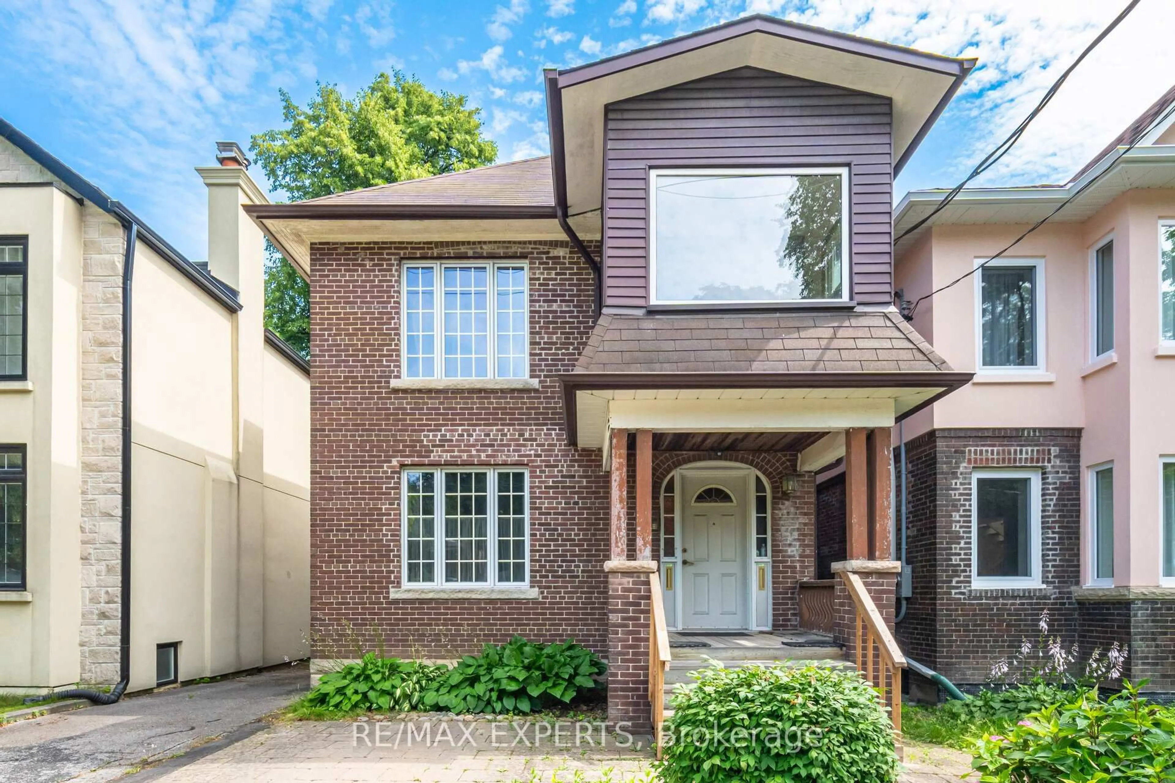 Home with brick exterior material, street for 121 Belsize Dr, Toronto Ontario M4S 1L3