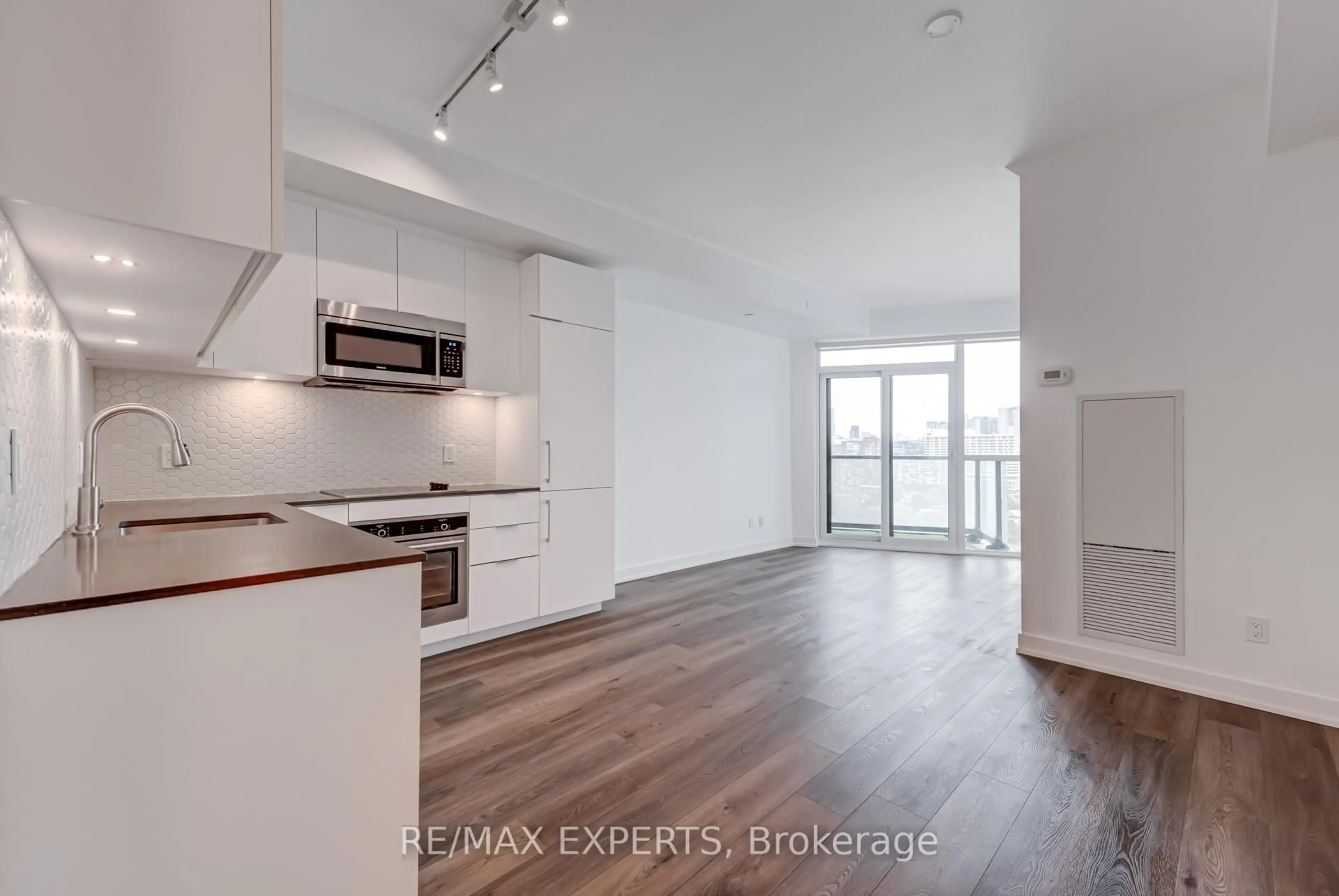 Open concept kitchen, wood/laminate floor for 50 Ordnance St #1410, Toronto Ontario M6K 0C9