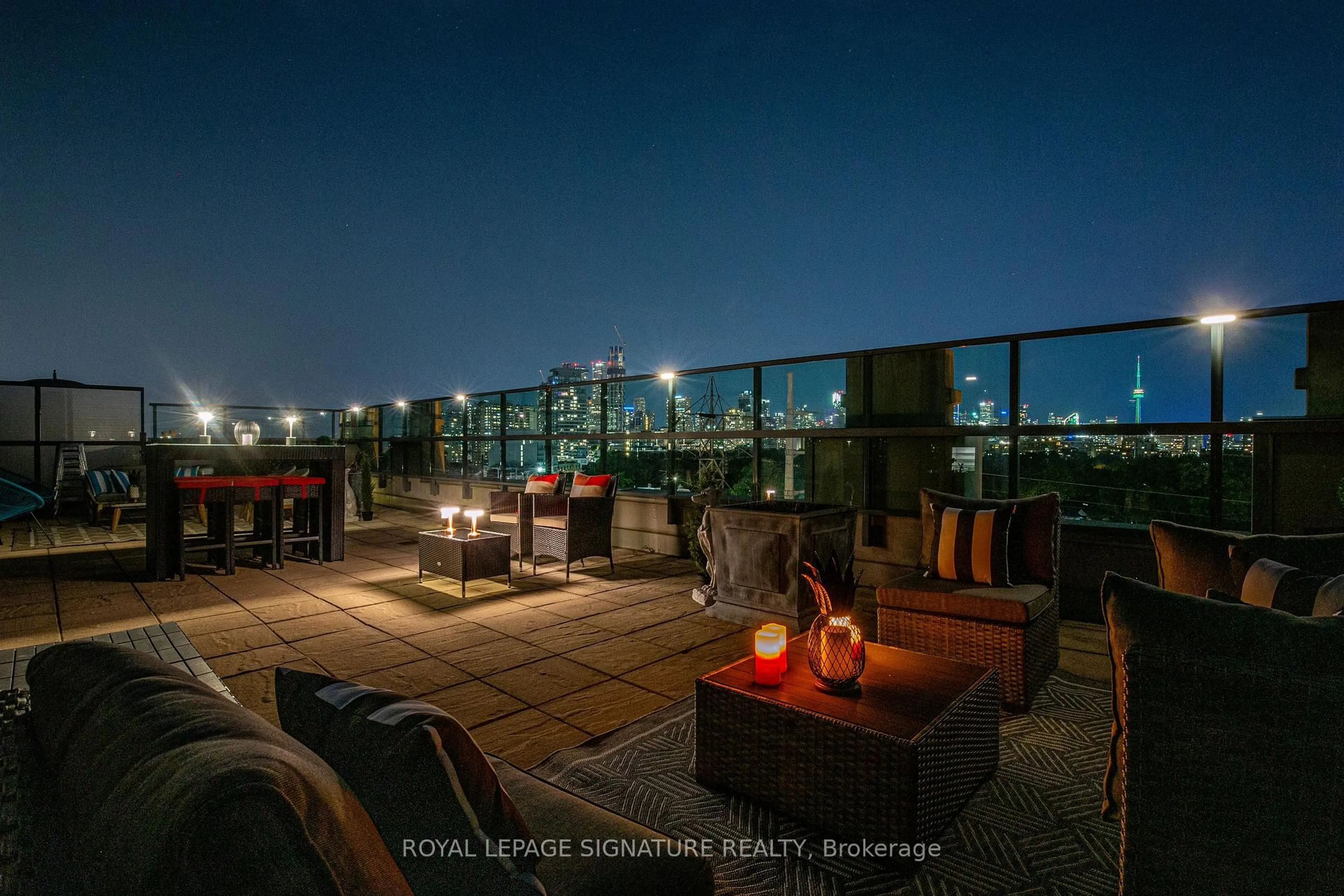 Patio, city buildings view from balcony for 380 Macpherson Ave #615, Toronto Ontario M4V 3E3