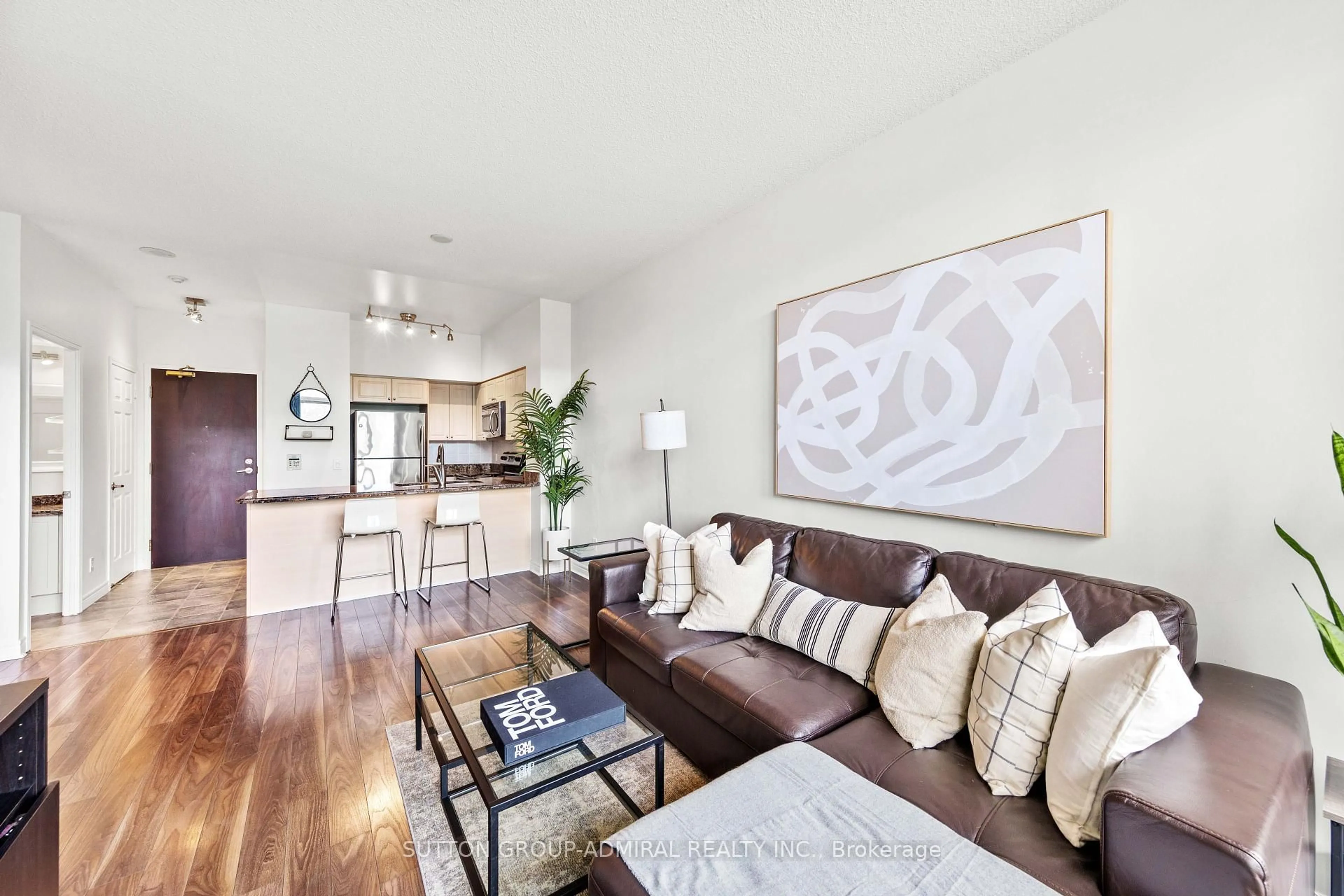 Living room with furniture, wood/laminate floor for 51 Lower Simcoe St #210, Toronto Ontario M5J 3A2