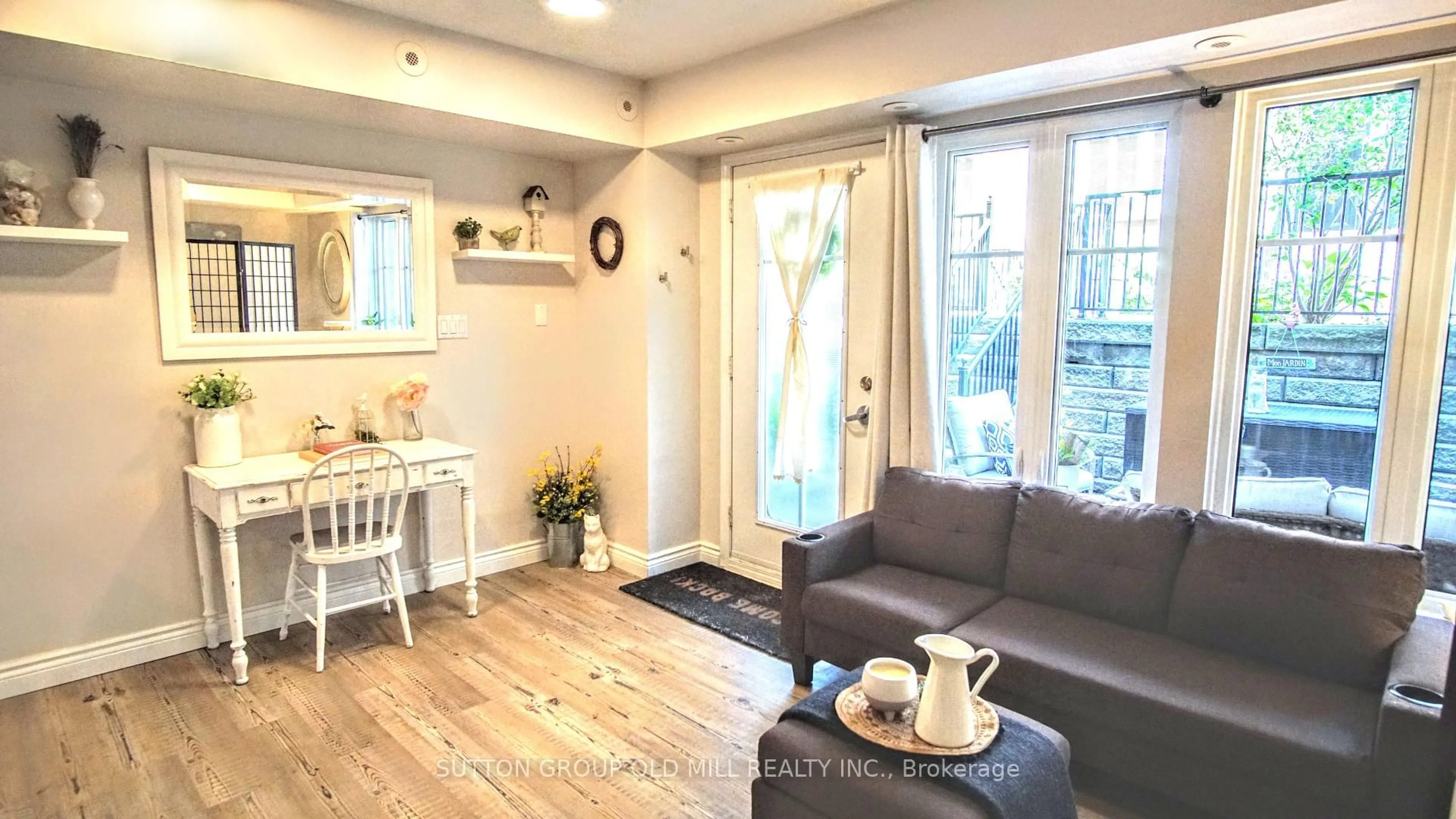 Living room with furniture, wood/laminate floor for 26 Western Battery Rd #206, Toronto Ontario M6K 3N9