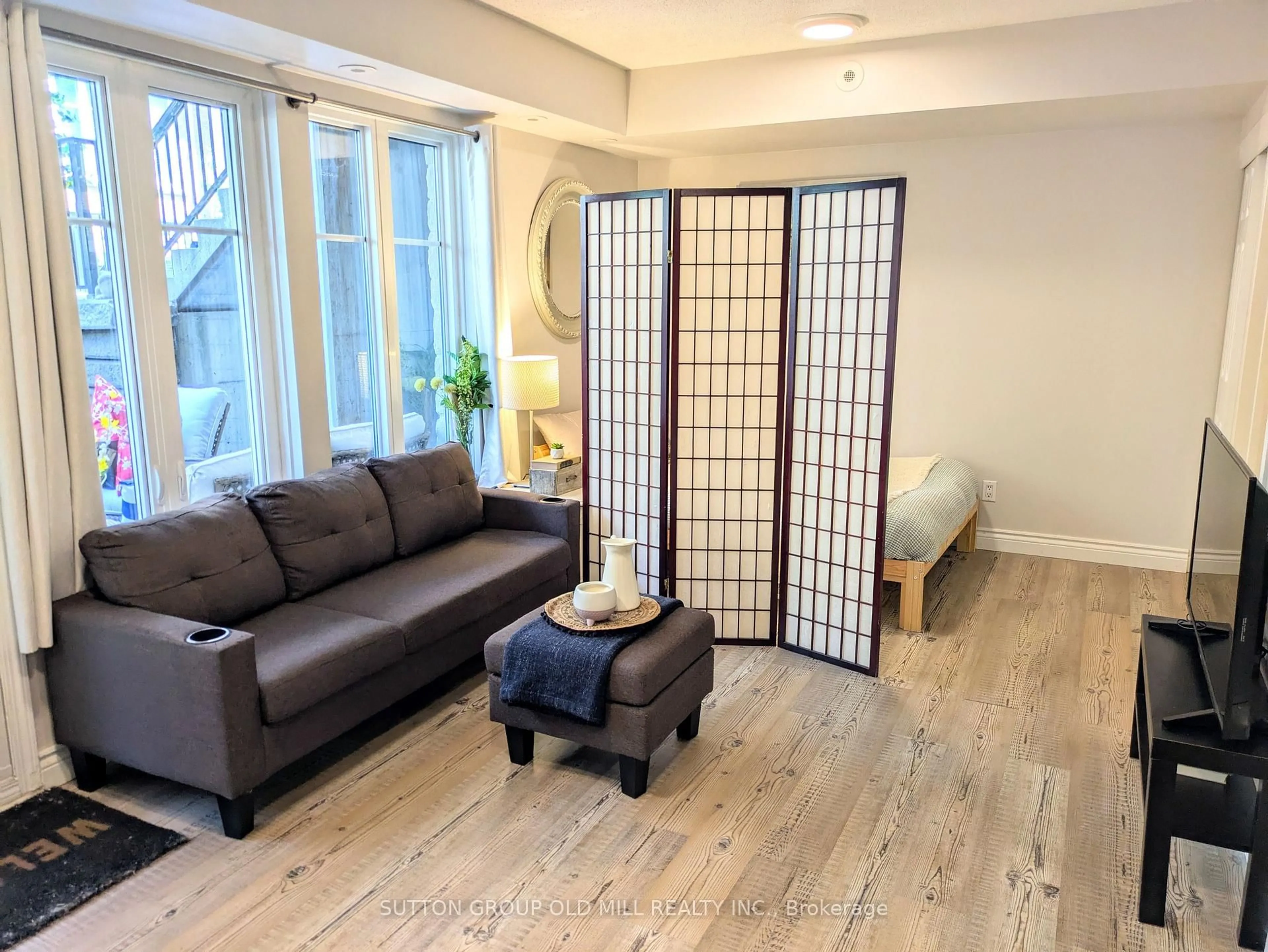 Living room with furniture, wood/laminate floor for 26 Western Battery Rd #206, Toronto Ontario M6K 3N9
