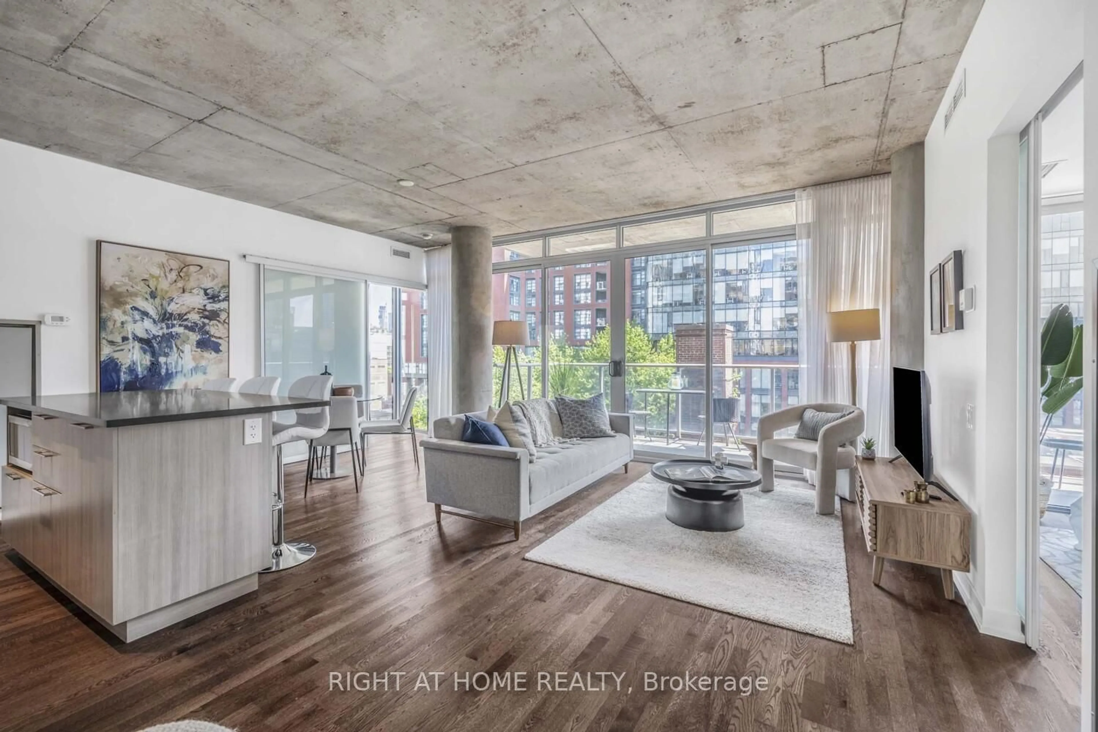 Living room with furniture, cement floor for 650 King St #706, Toronto Ontario M5V 0H6