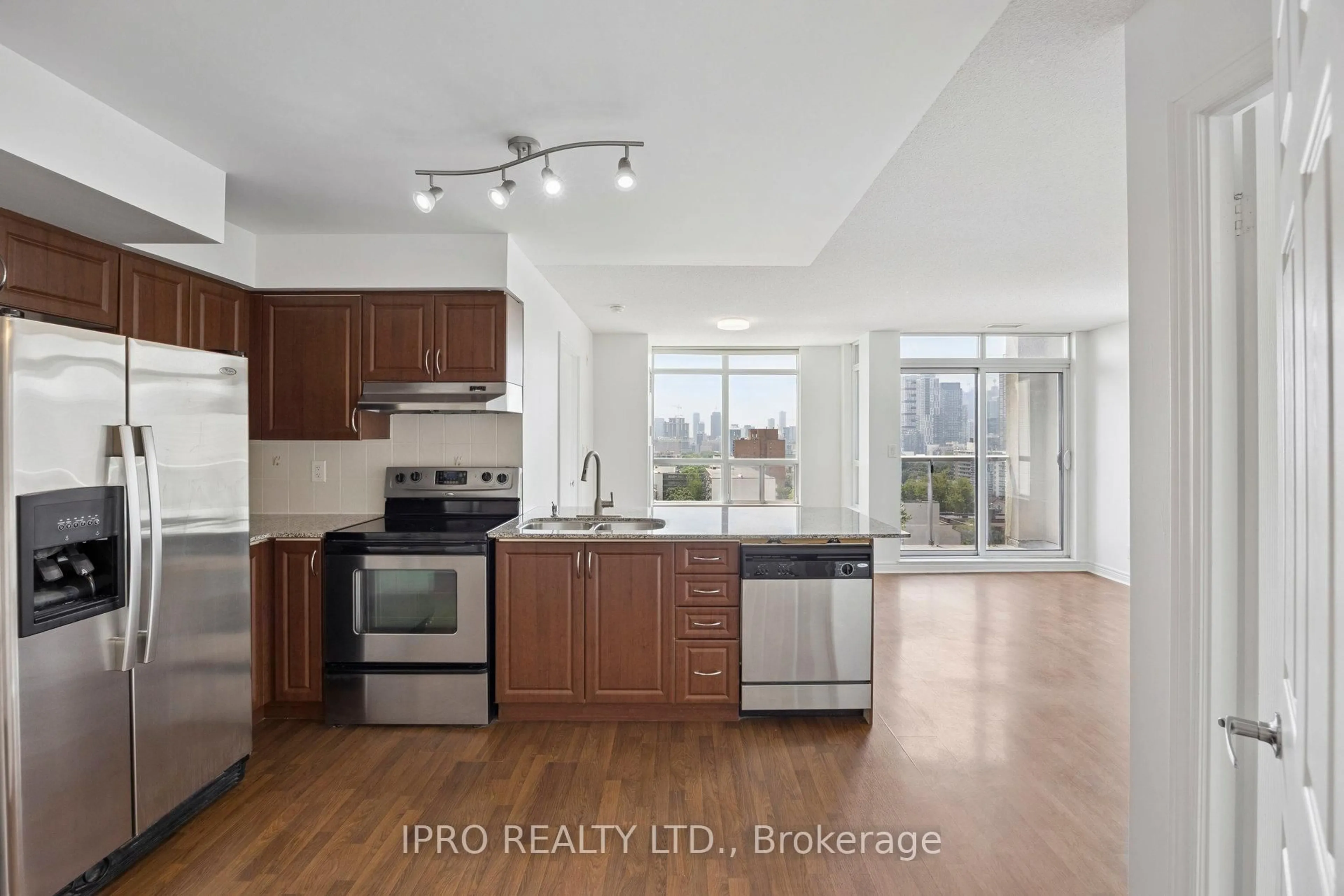 Open concept kitchen, wood/laminate floor for 225 Wellesley St #1203, Toronto Ontario M4X 1X8