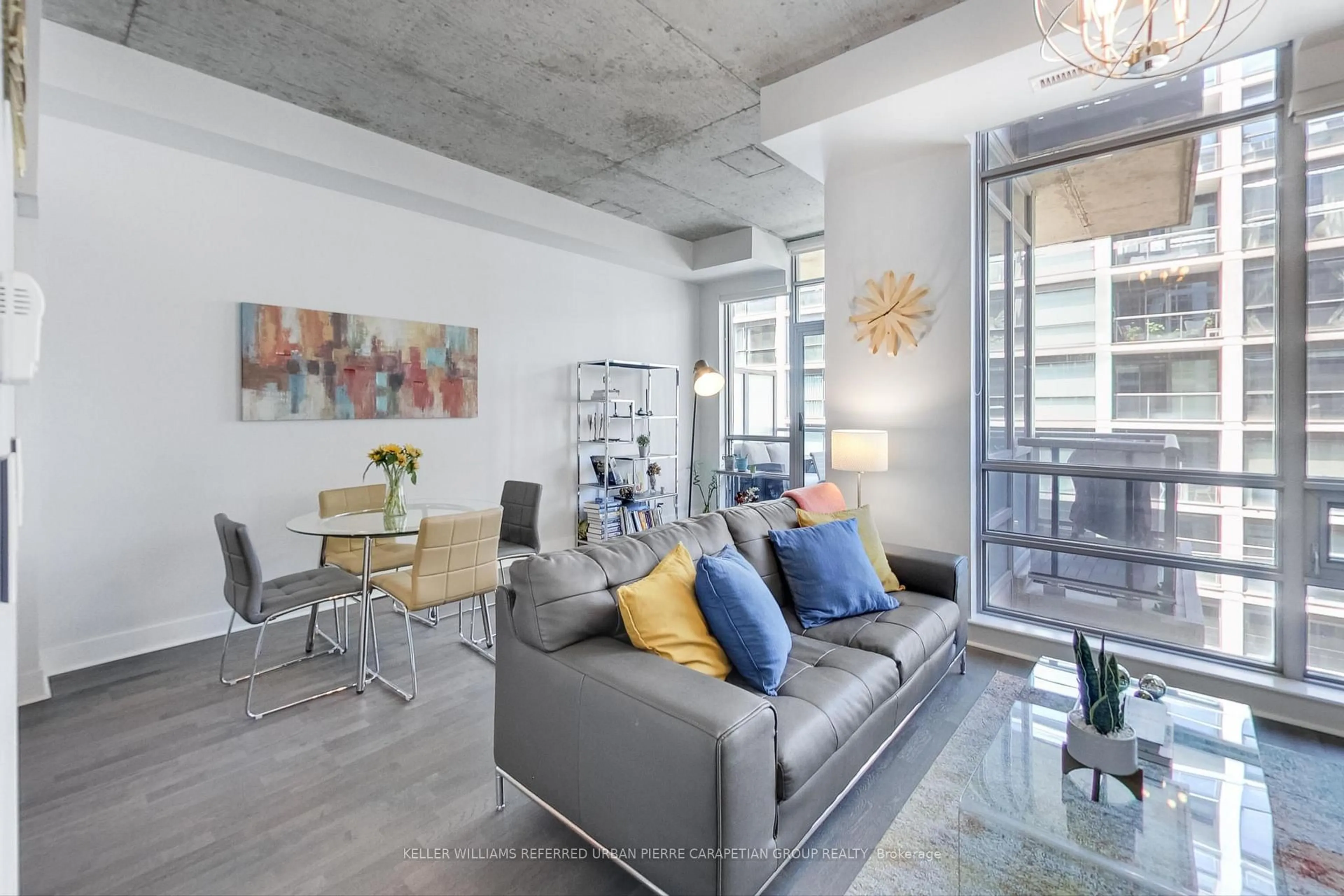 Living room with furniture, cement floor for 399 Adelaide St #520, Toronto Ontario M5V 1S4