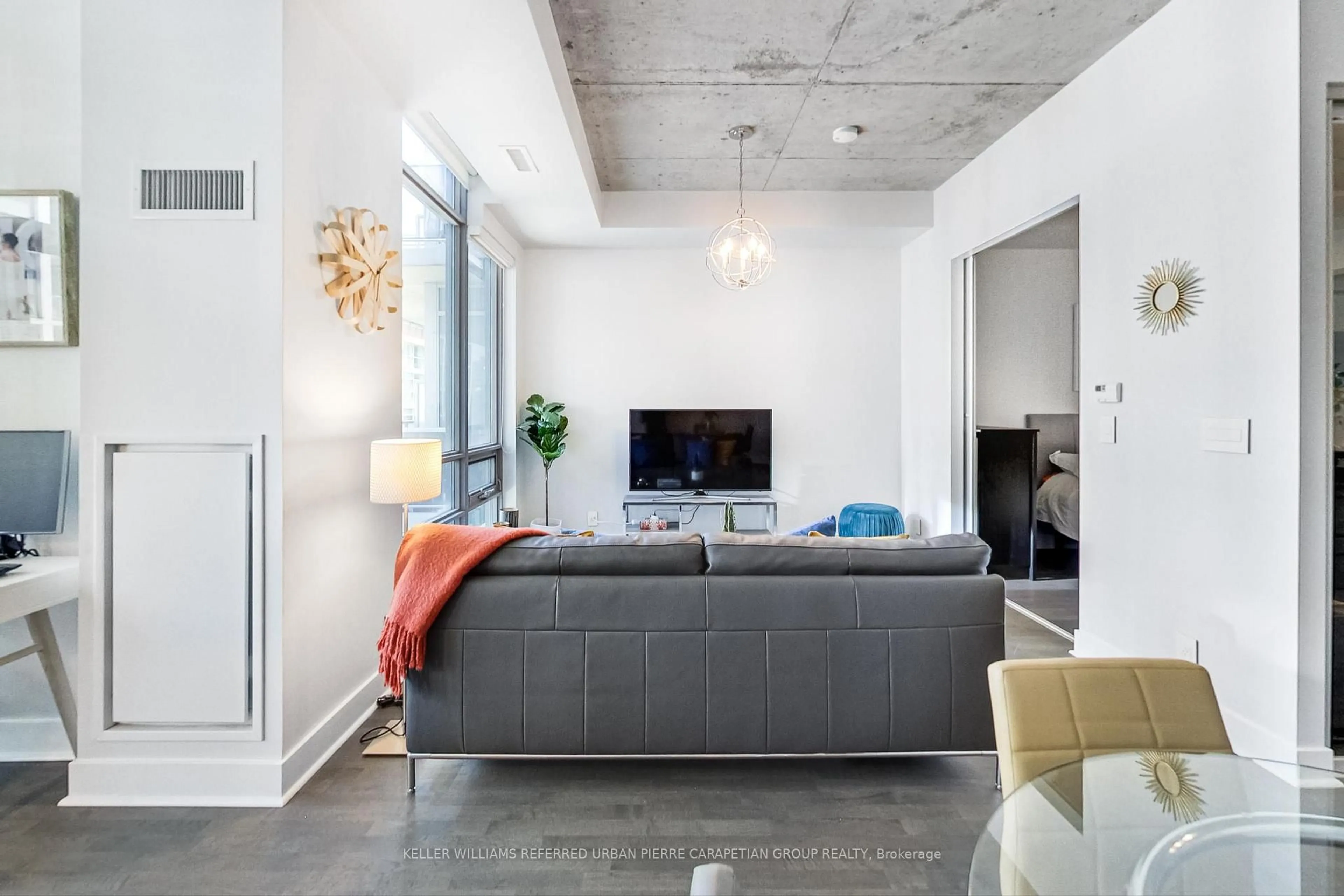Living room with furniture, cement floor for 399 Adelaide St #520, Toronto Ontario M5V 1S4