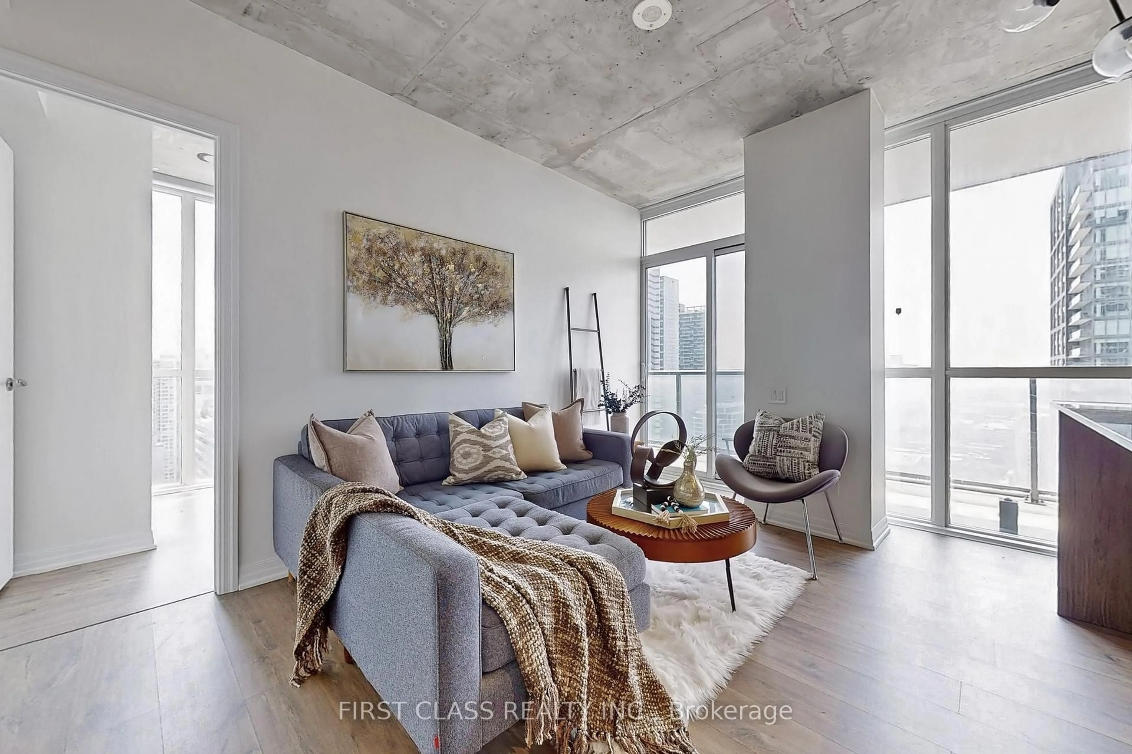Living room with furniture, cement floor for 88 Blue Jays Way #2708, Toronto Ontario M5V 0L7