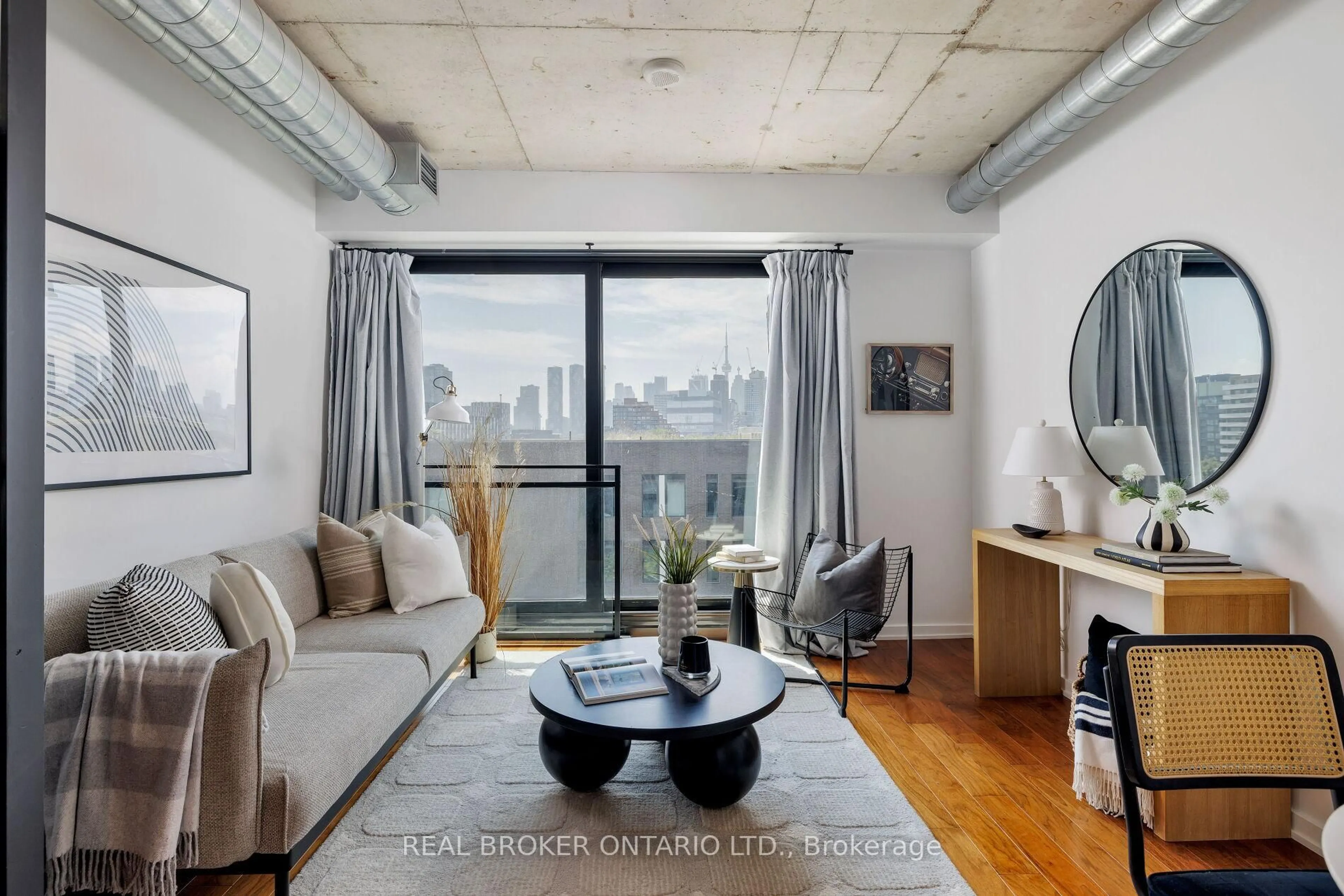 Living room with furniture, cement floor for 47 Lower River St #539, Toronto Ontario M5A 0G1