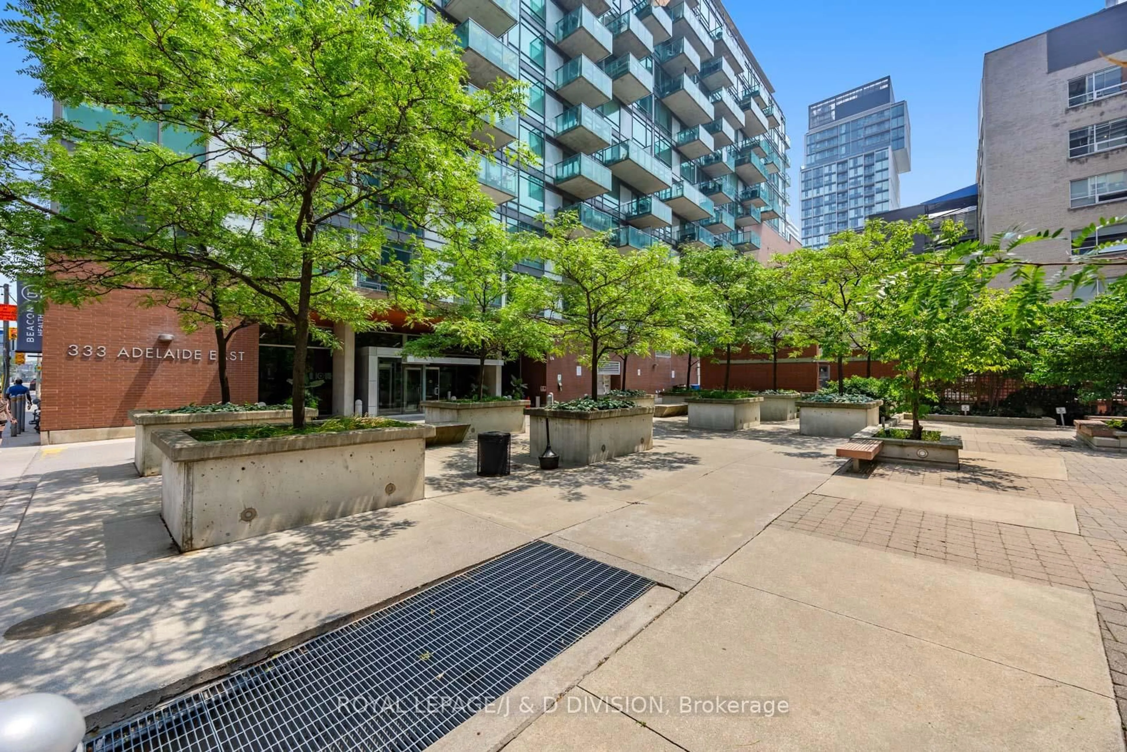 Patio, city buildings view from balcony for 218 King St #407, Toronto Ontario M5A 4T4