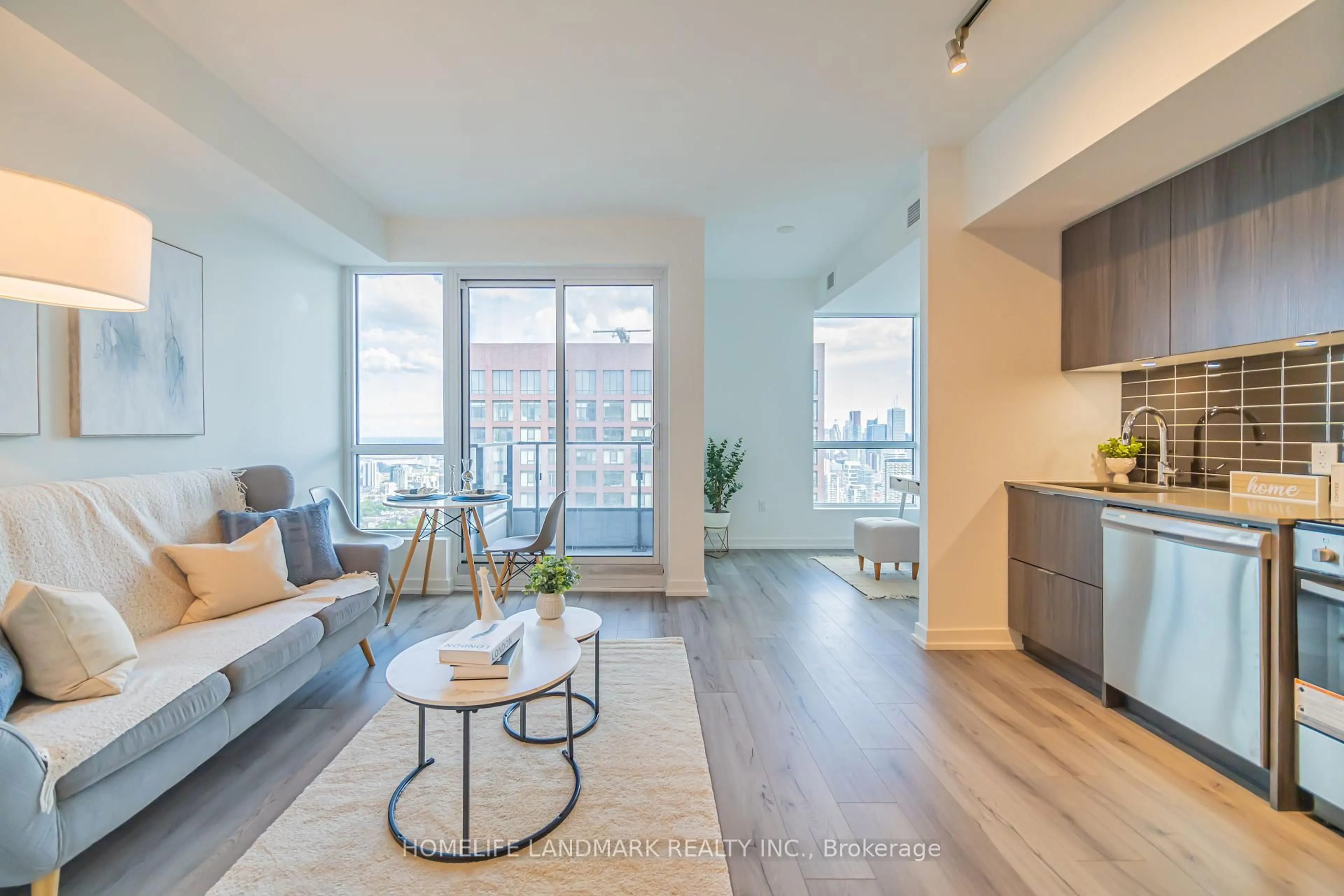 Living room with furniture, wood/laminate floor for 395 Bloor St #5001, Toronto Ontario M4W 0B4