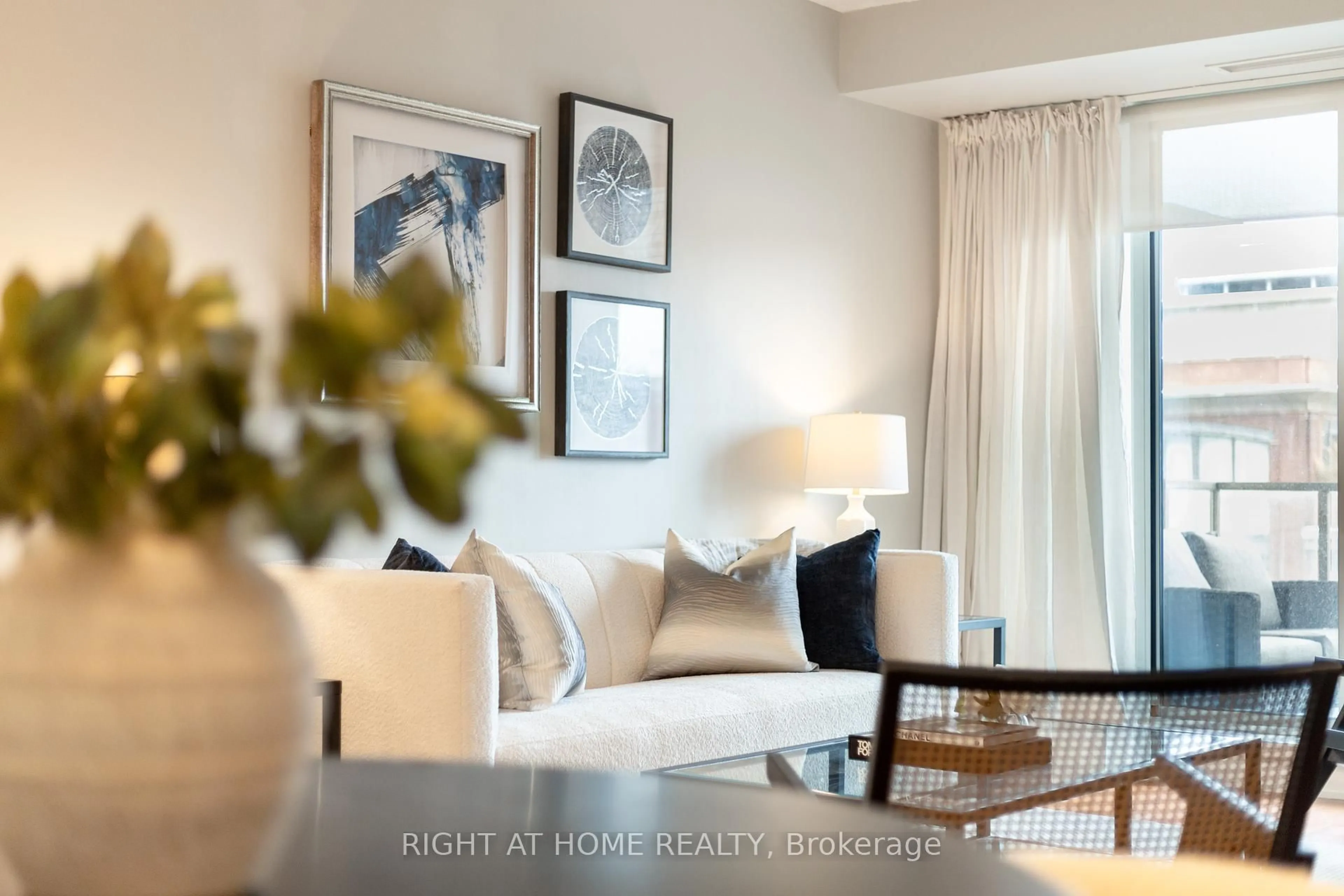 Living room with furniture, wood/laminate floor for 18 Beverley St #703, Toronto Ontario M5T 3L2