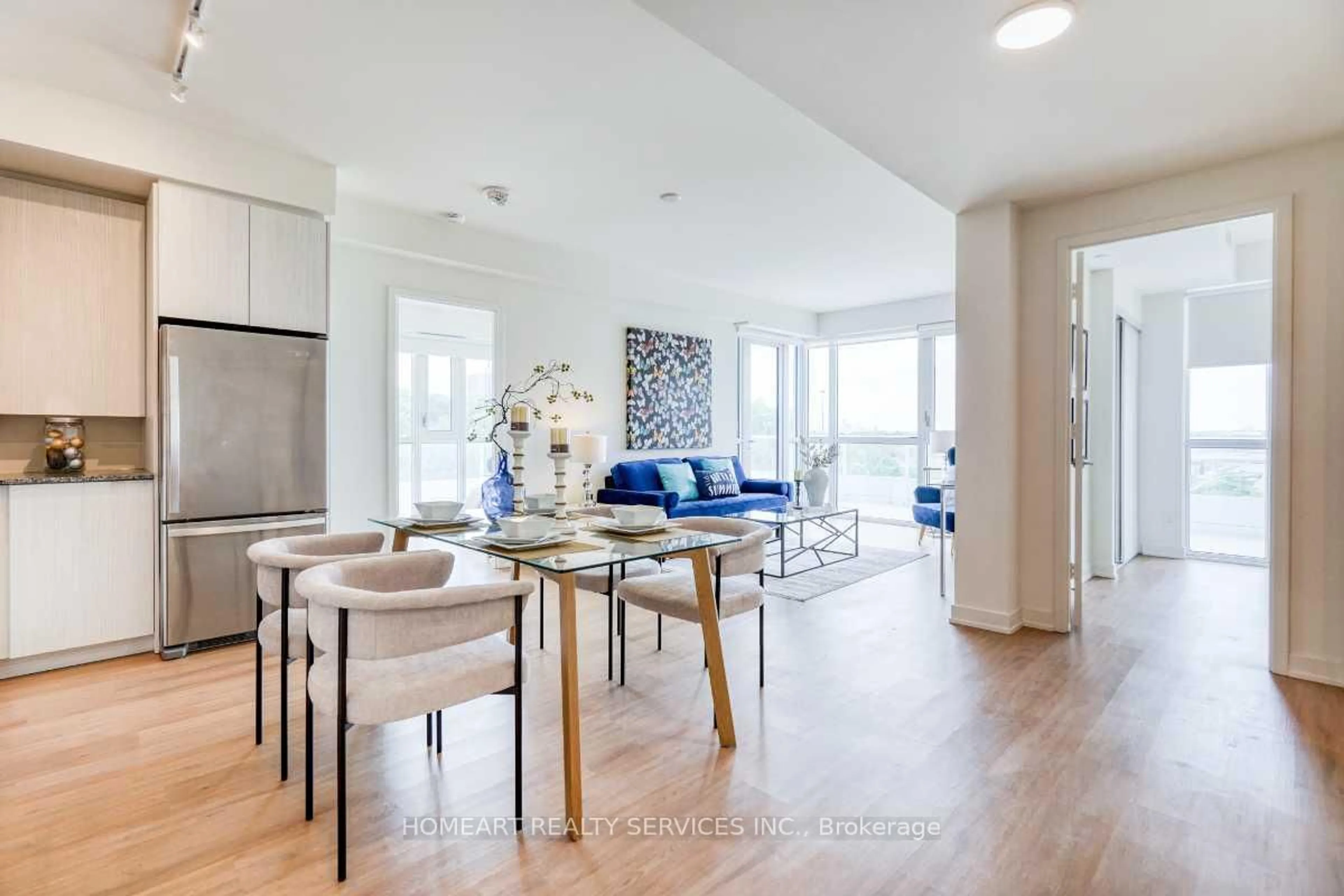 Living room with furniture, wood/laminate floor for 10 Deerlick Crt #402, Toronto Ontario M3A 0A7