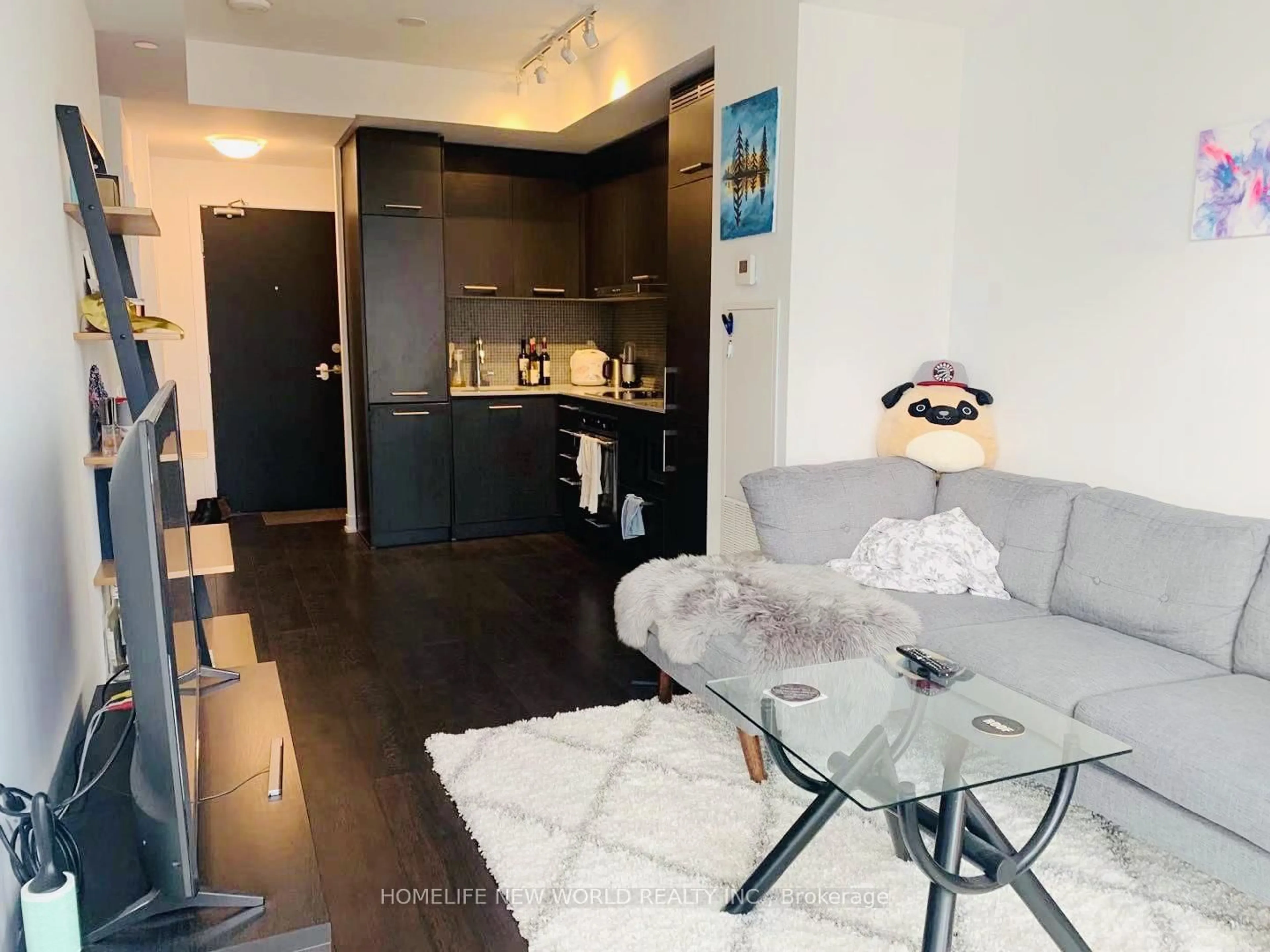 Living room with furniture, wood/laminate floor for 87 Peter St #3315, Toronto Ontario M5V 0P1