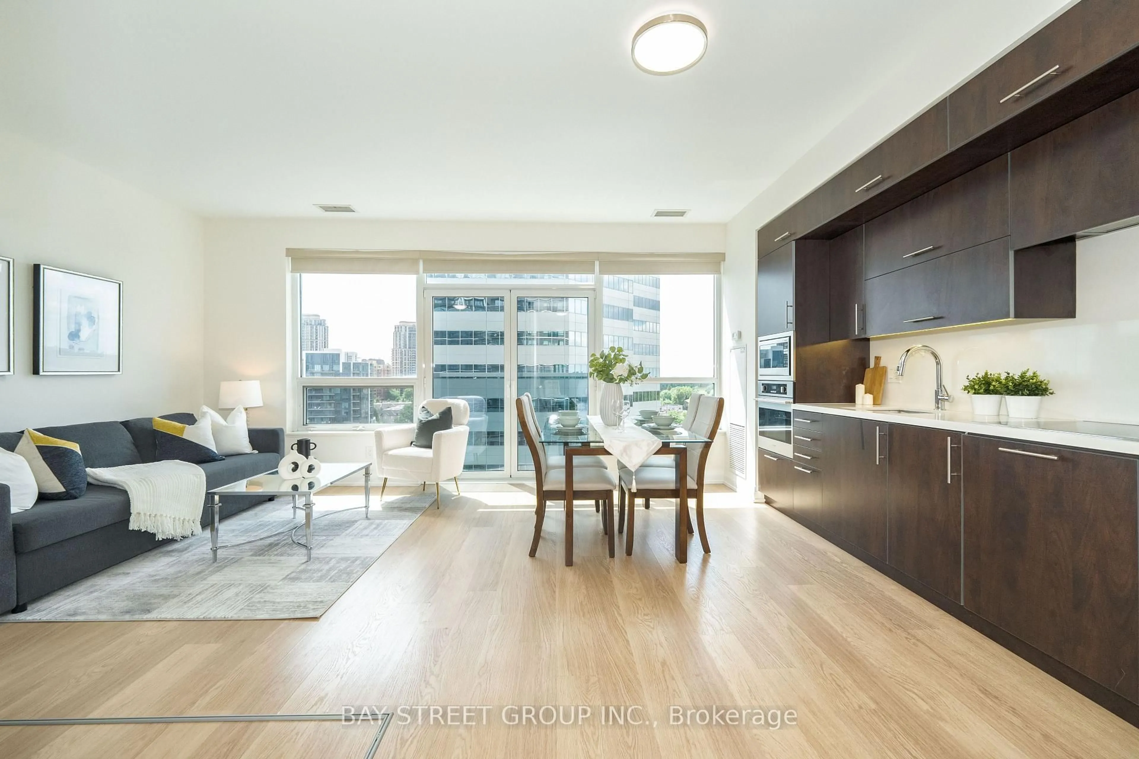 Living room with furniture, wood/laminate floor for 2 Anndale Dr #909, Toronto Ontario M2N 0G2